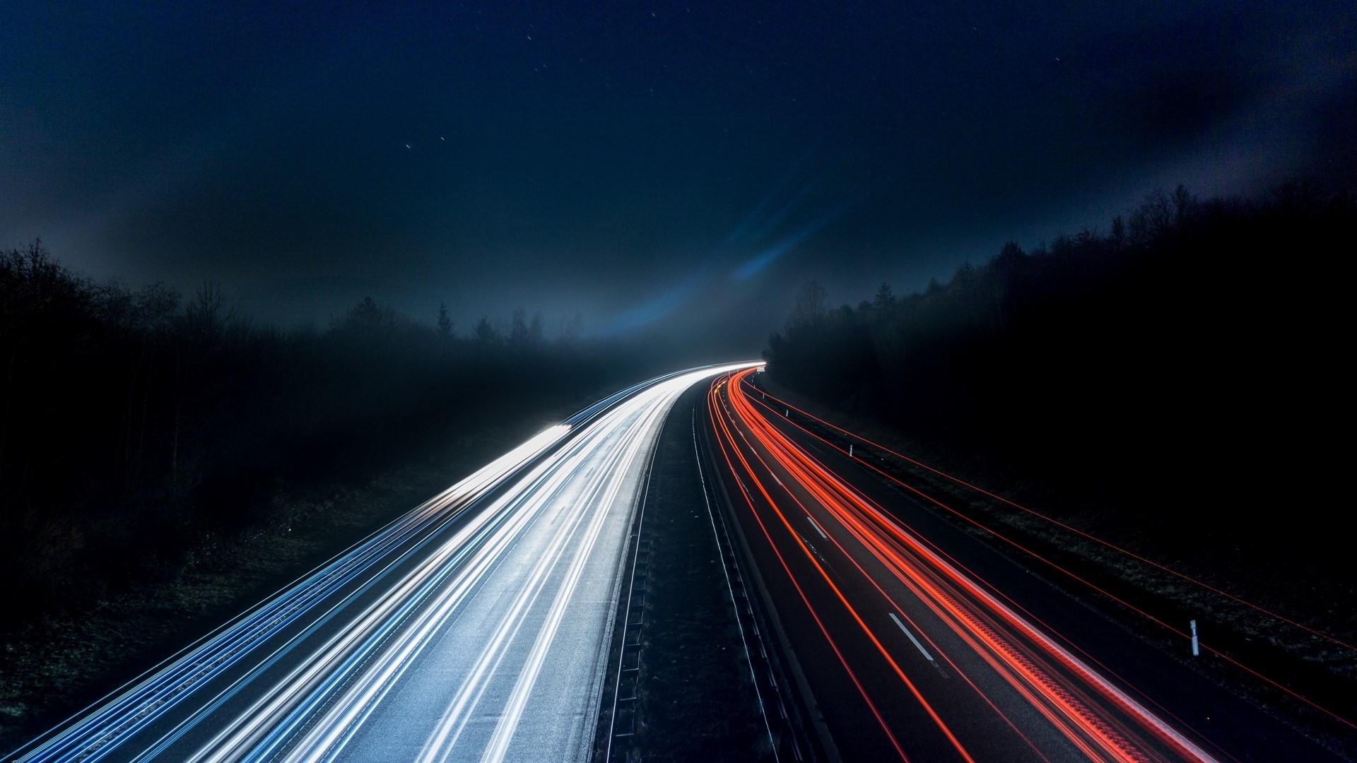 Long exposure of highway at night with light trails HD Wallpaper