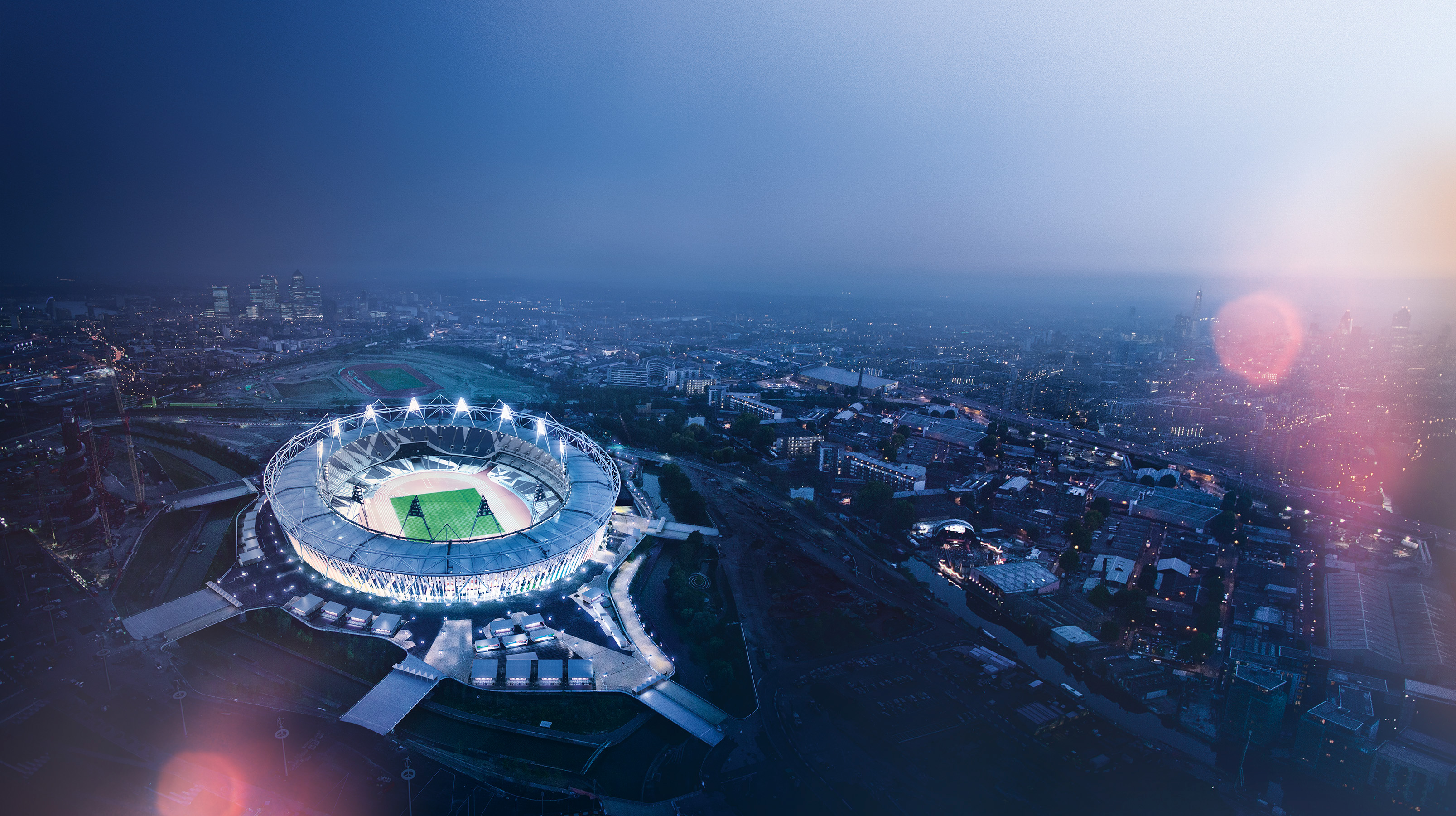 Aerial view of the Olympic Stadium at dusk HD Wallpaper