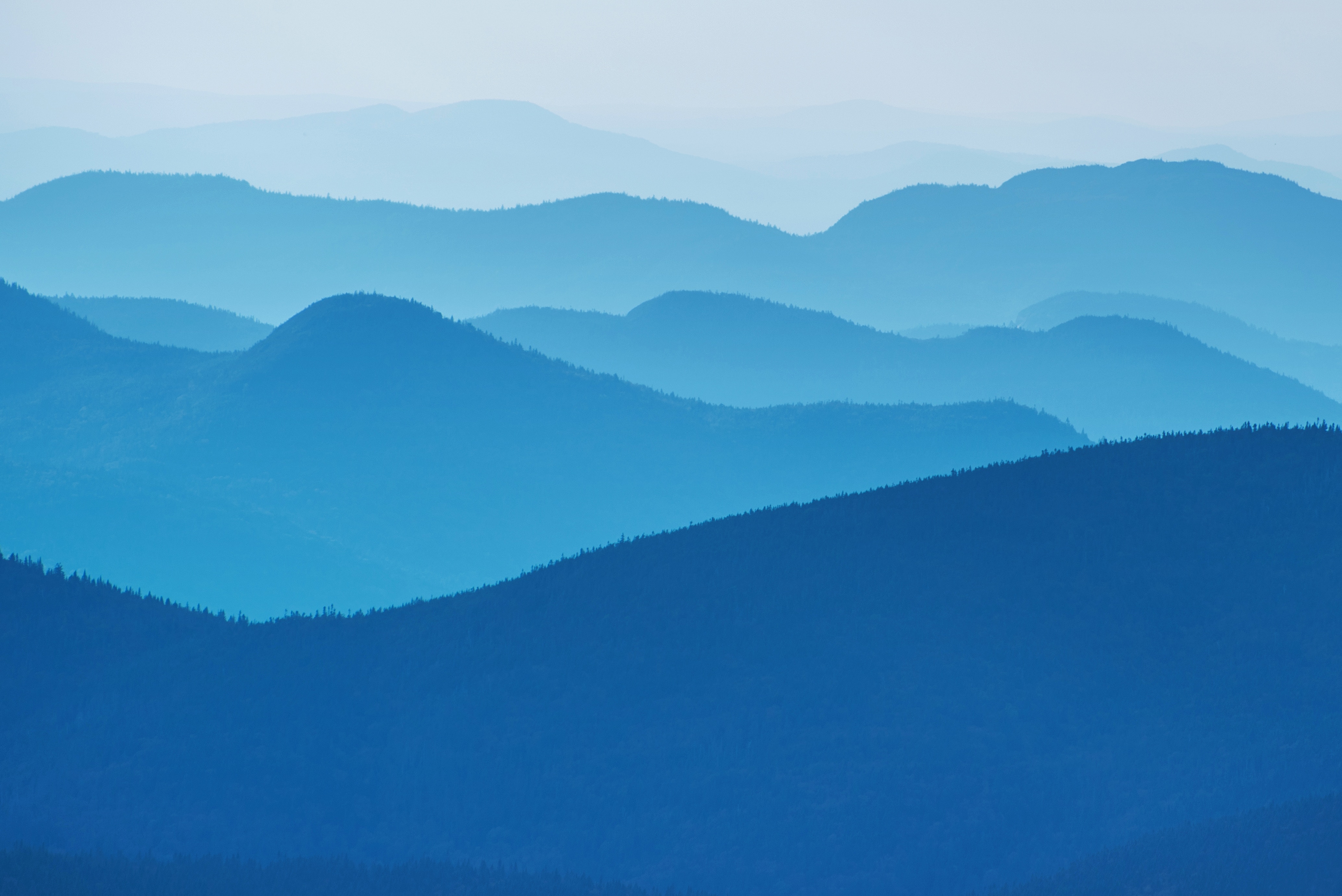Layered Blue Mountains in Fog HD Wallpaper