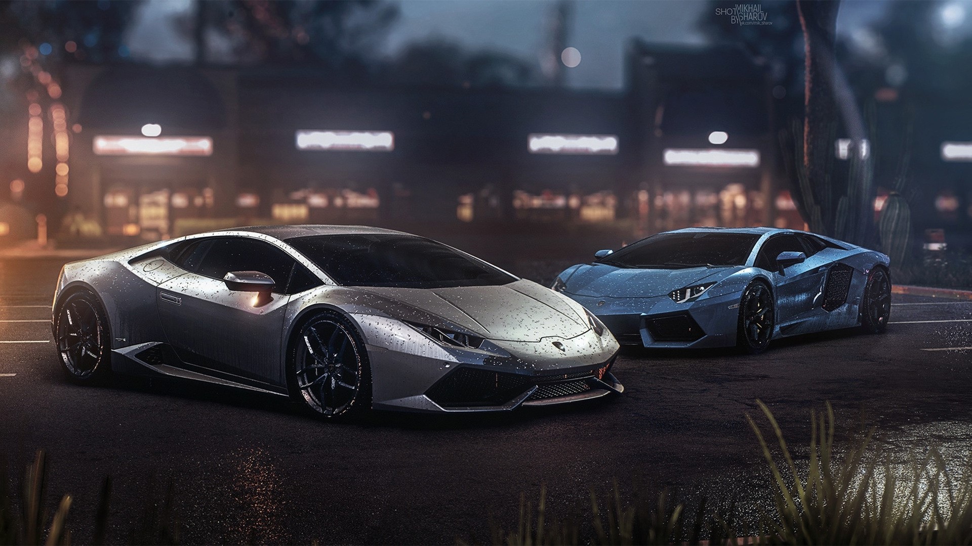 Two Lamborghinis on a wet street at night HD Wallpaper