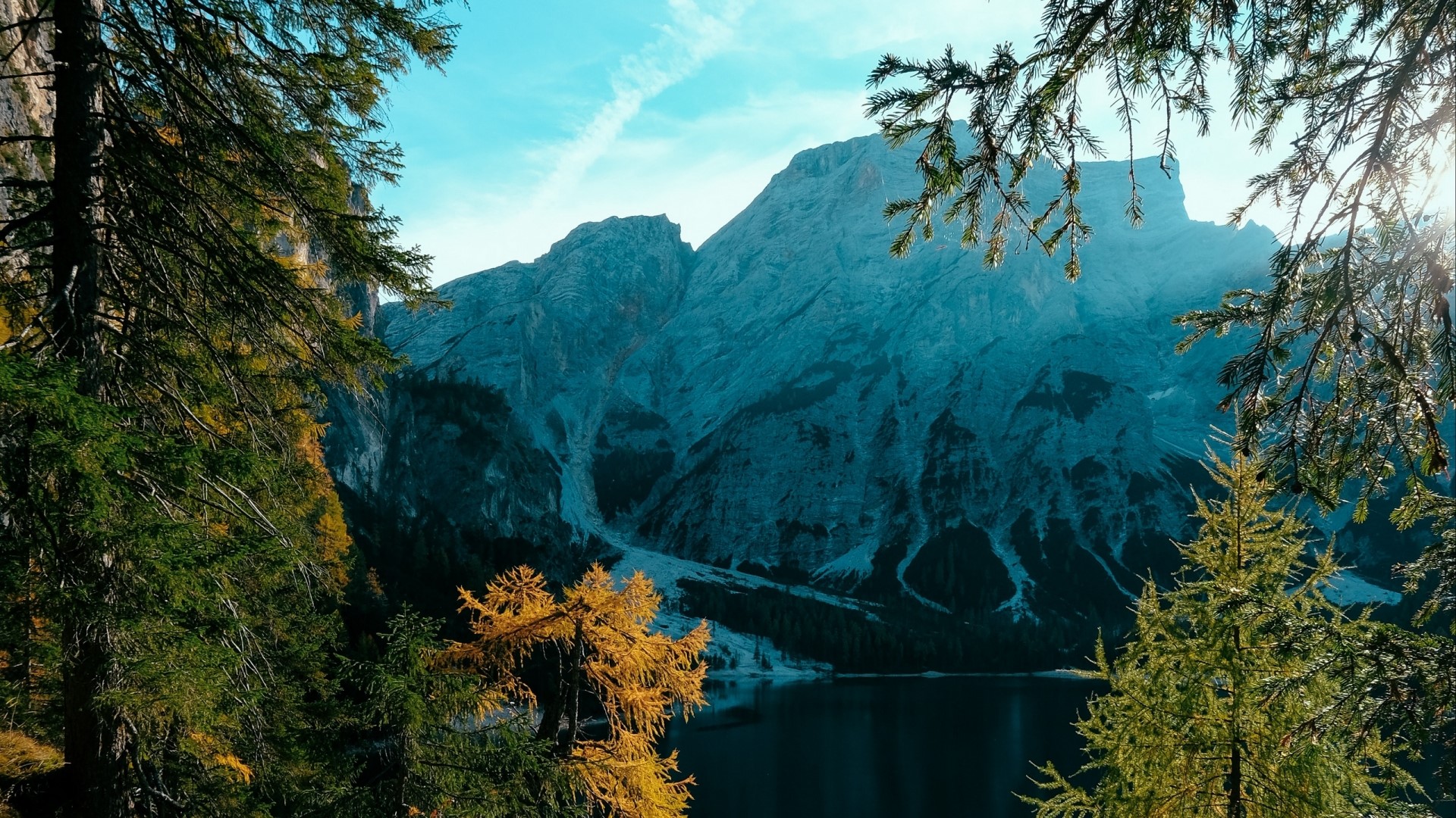Lake and Mountains framed by Trees HD Wallpaper