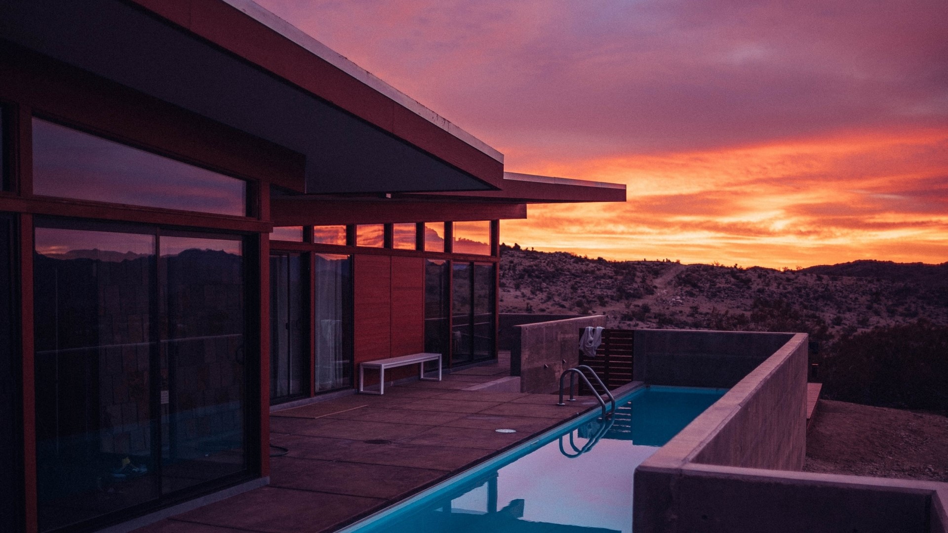 Modern house with pool at sunset HD Wallpaper