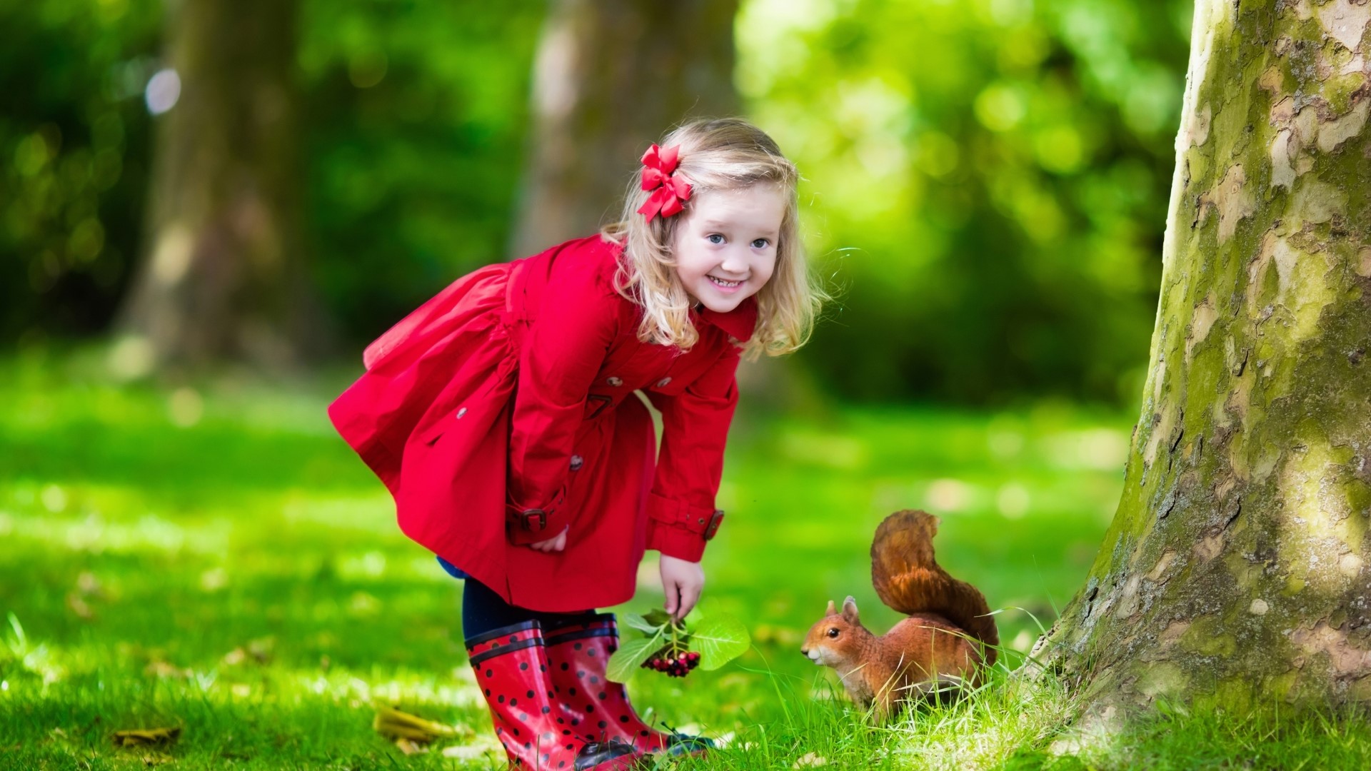 Girl in red coat with squirrel in park HD Wallpaper