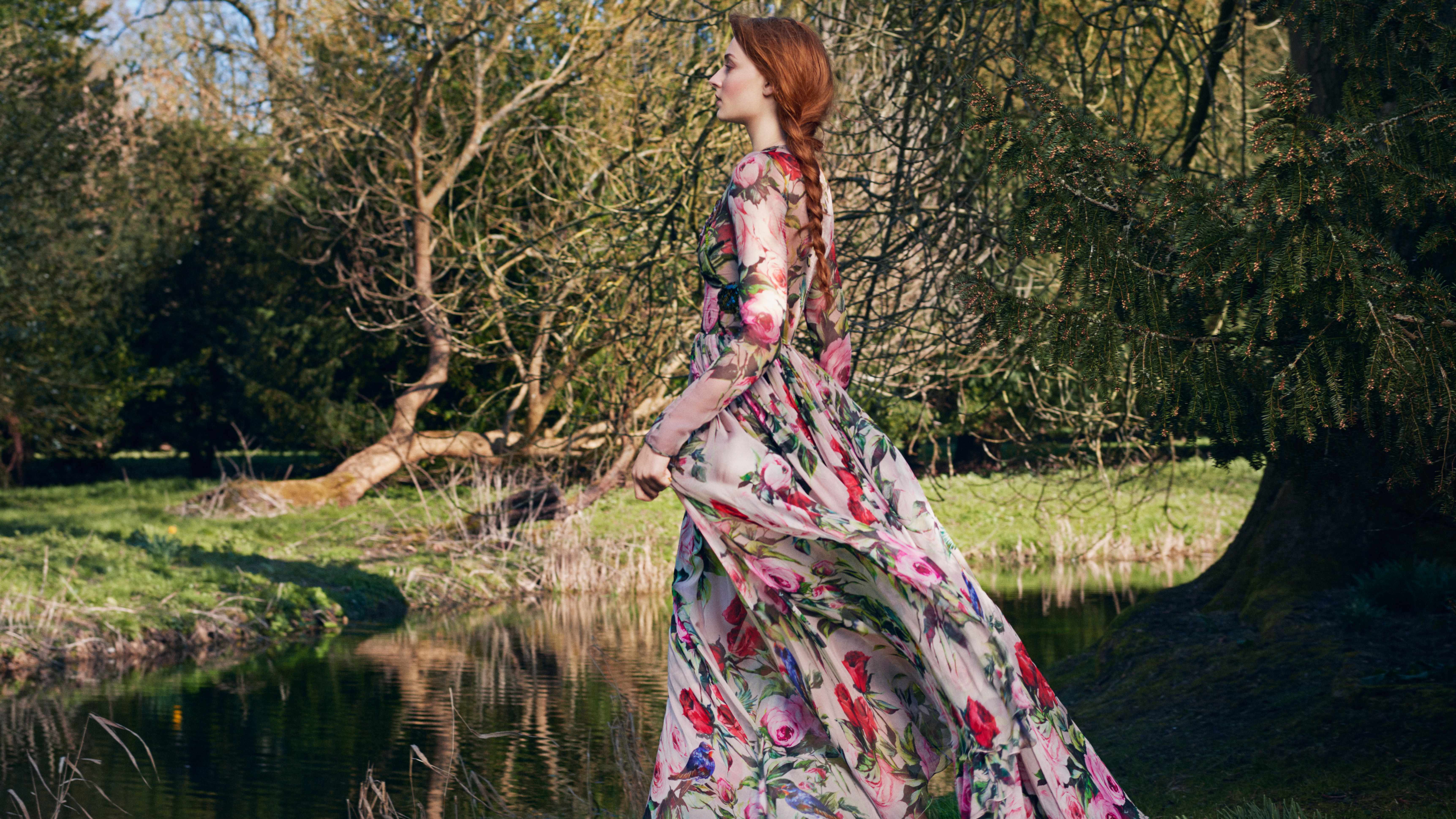 Sophie Turner in a floral dress by a pond HD Wallpaper