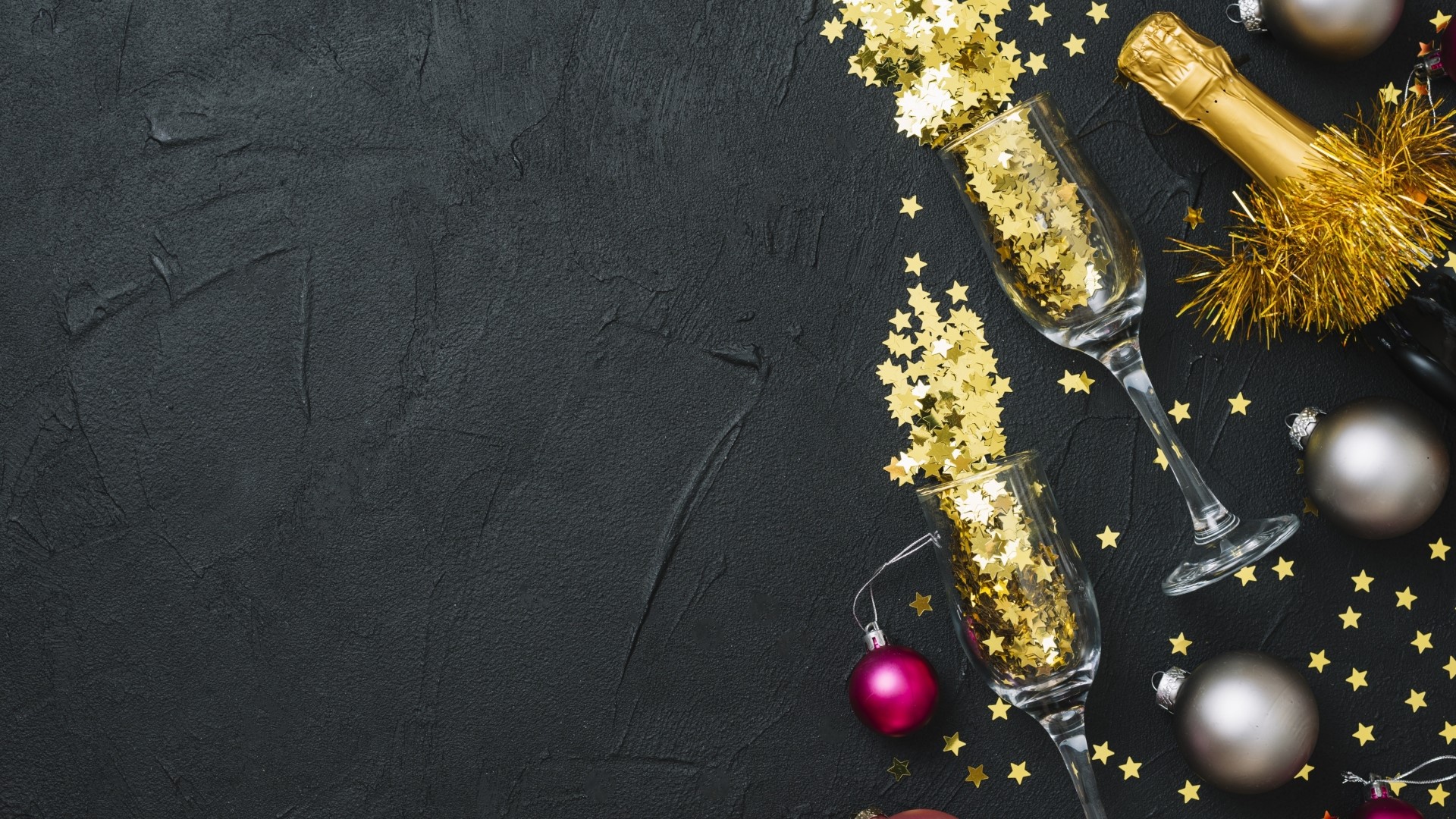 Champagne bottle and glasses with gold stars and ornaments HD Wallpaper