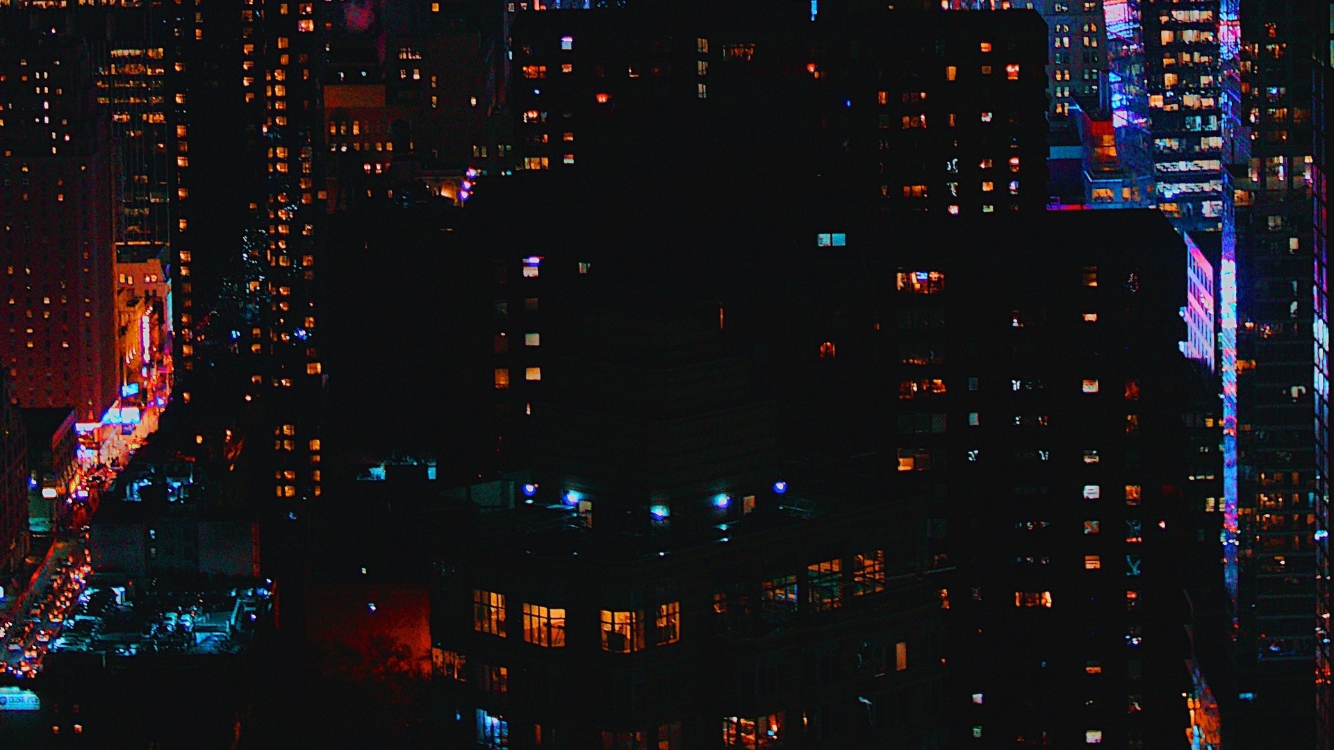 Night city skyline with illuminated buildings HD Wallpaper