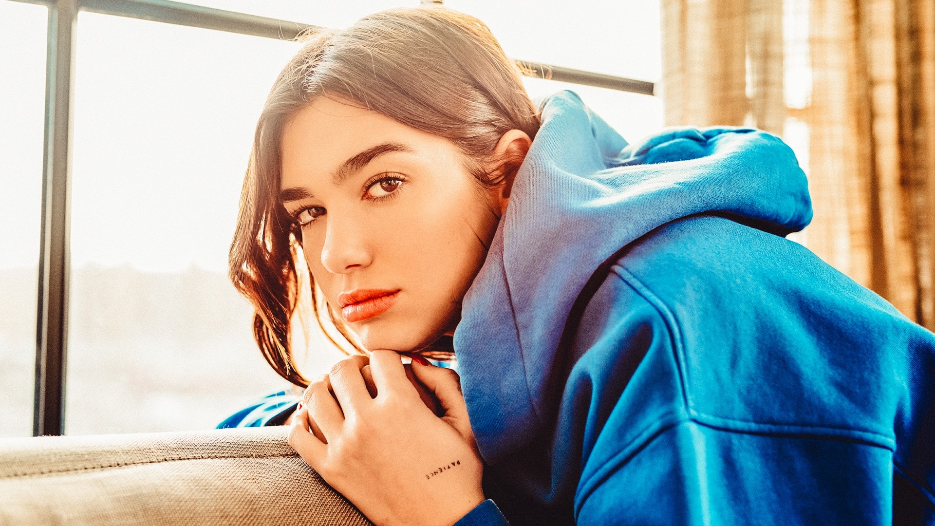 Dua Lipa wearing a blue hoodie HD Wallpaper