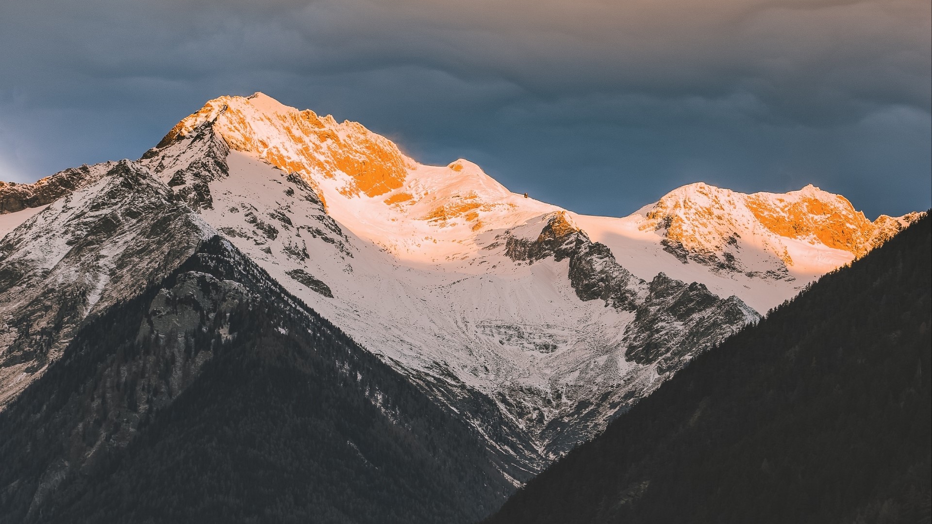 Snow-capped mountains at sunset HD Wallpaper