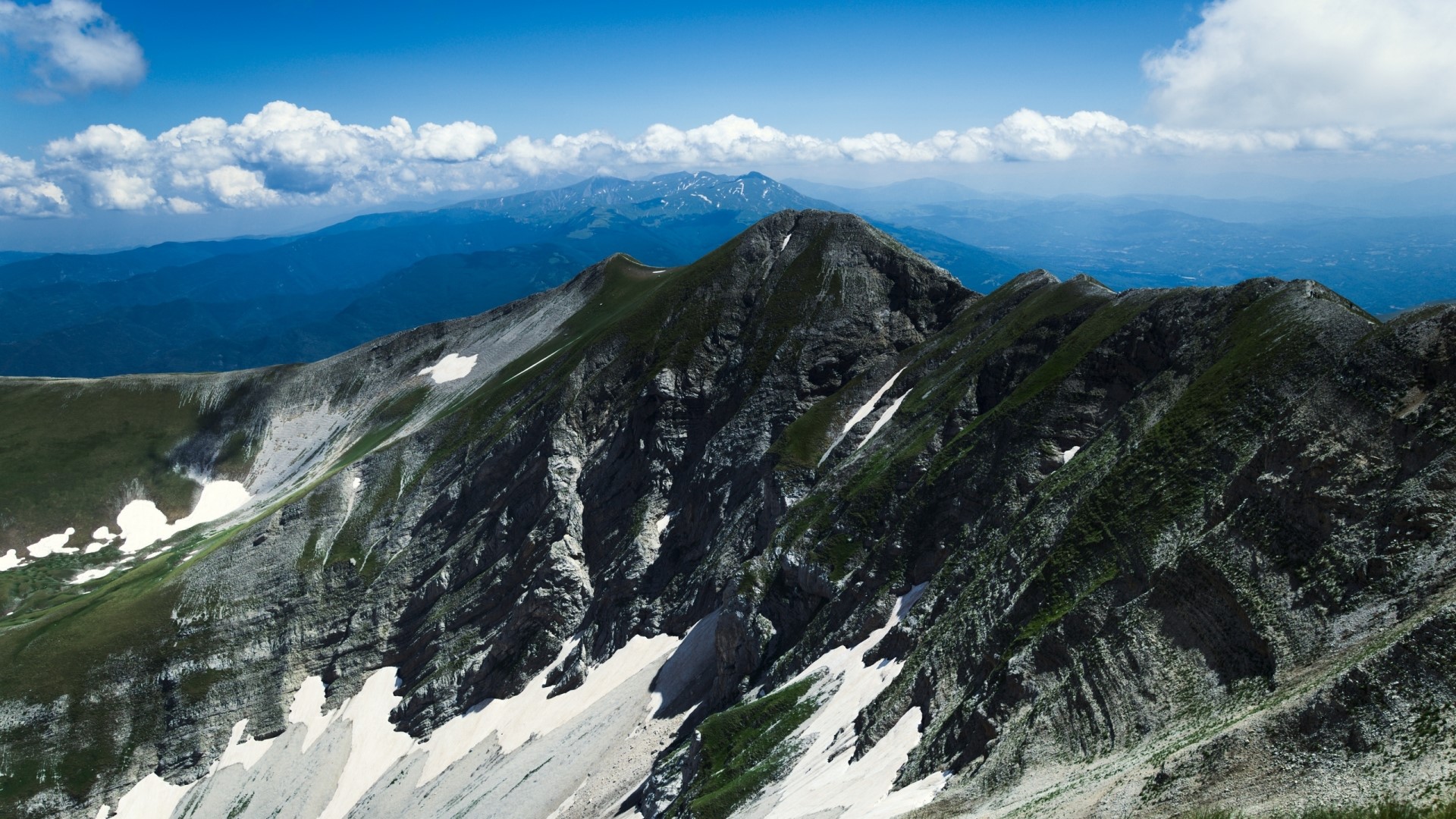 Mountain range in Italy with snow patches HD Wallpaper