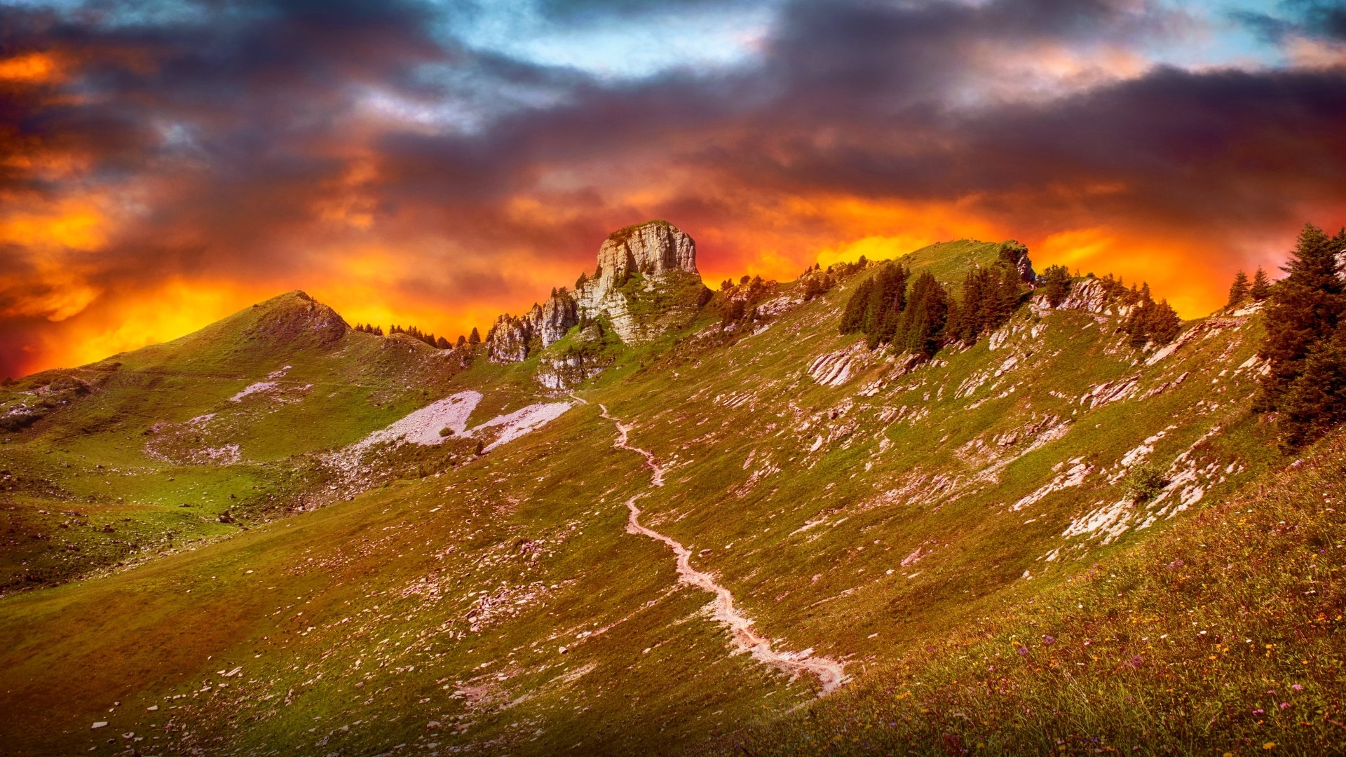 Mountain range with dramatic sunset sky HD Wallpaper