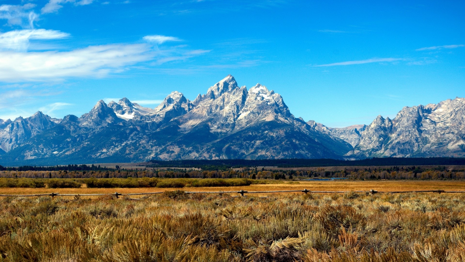 Grand Teton Mountains under a blue sky HD Wallpaper