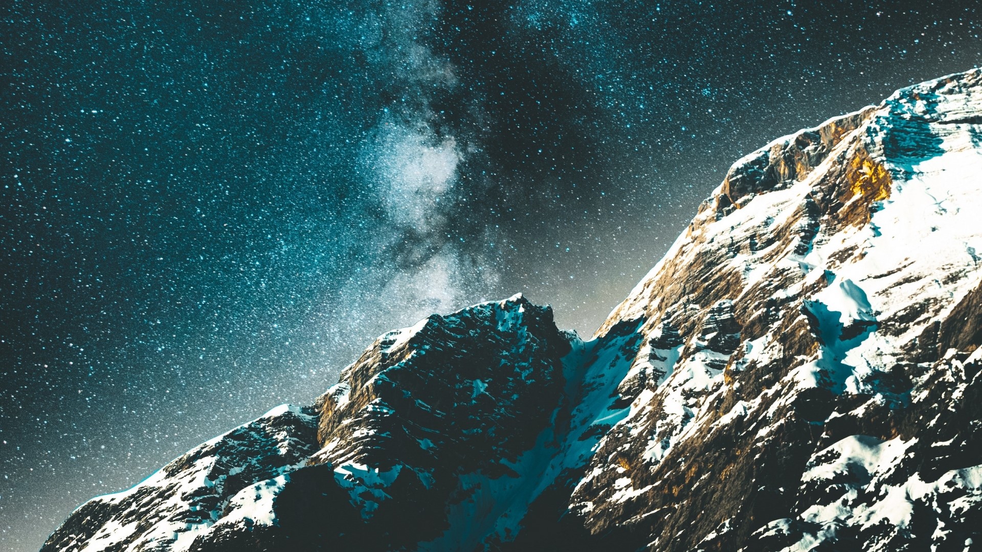 Snowy mountains under a starry sky HD Wallpaper