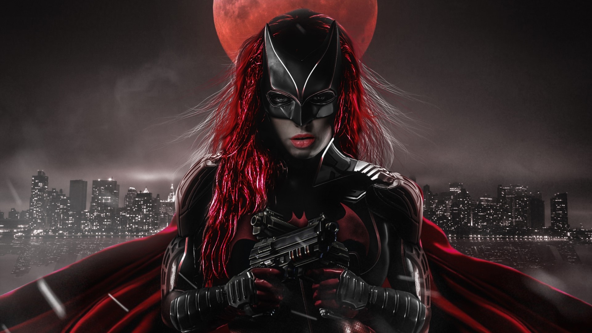 Batwoman with red hair and guns in front of city HD Wallpaper