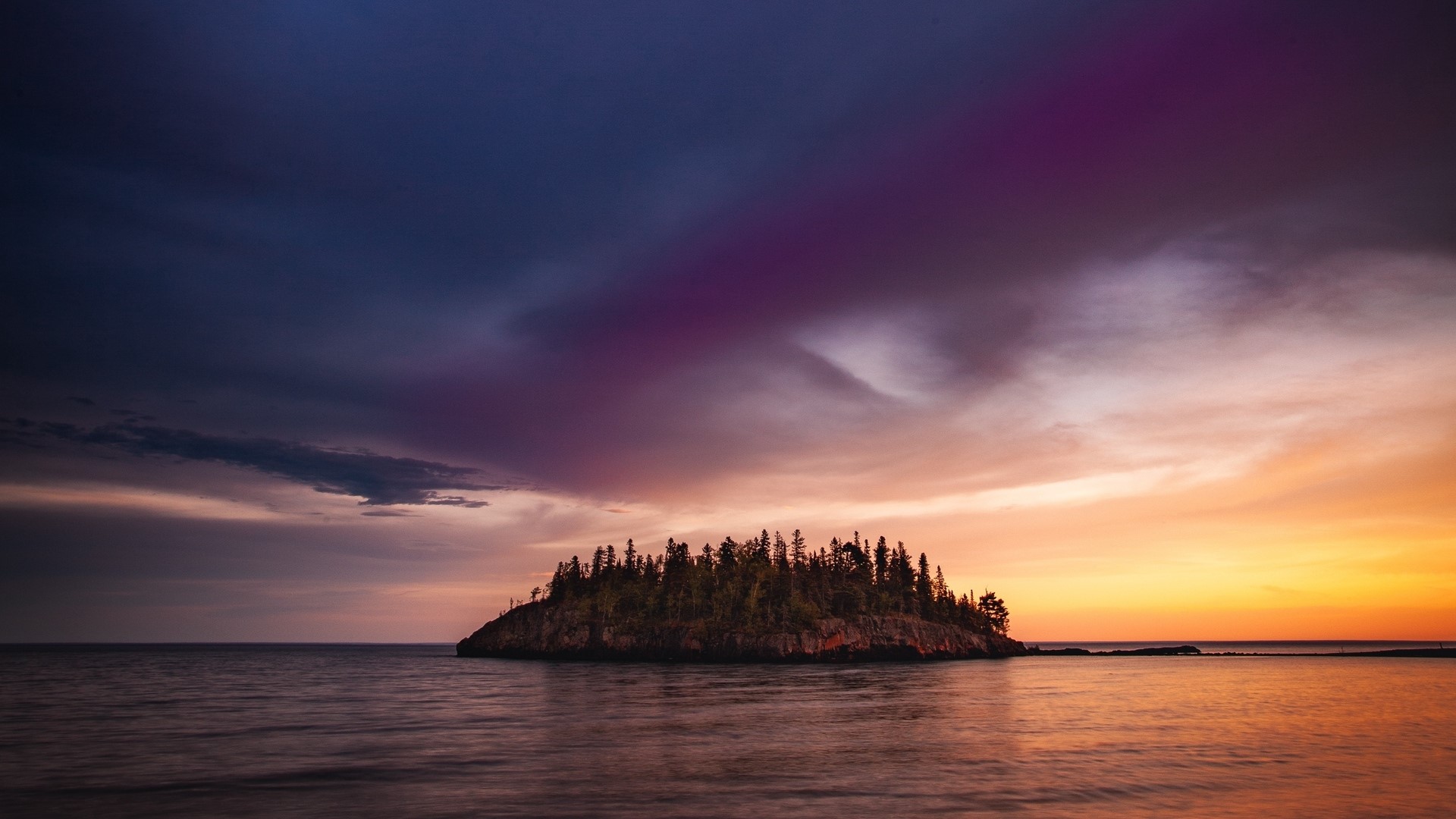 Island with trees in the ocean at sunset HD Wallpaper