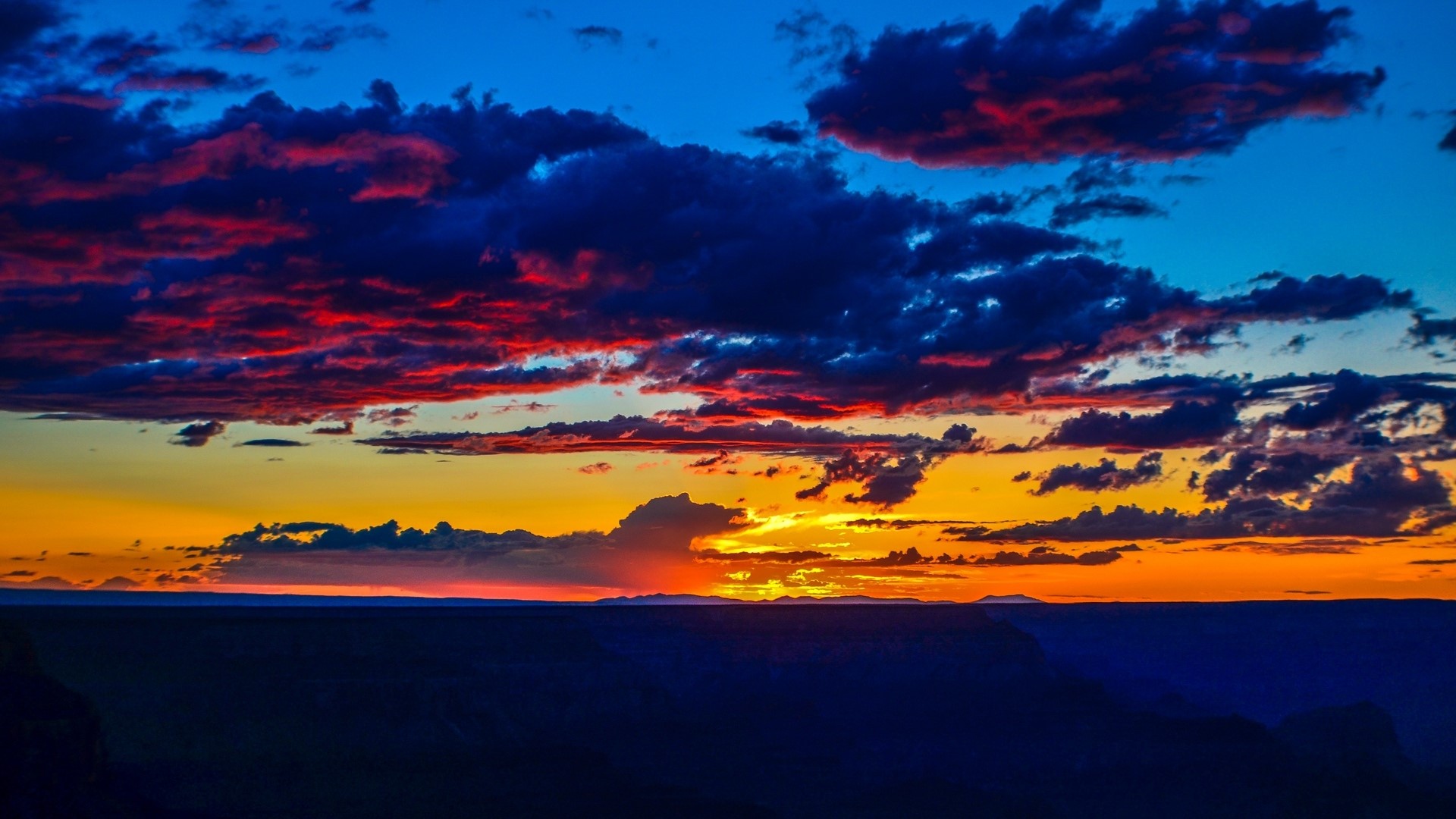 Sunset over a vast landscape HD Wallpaper