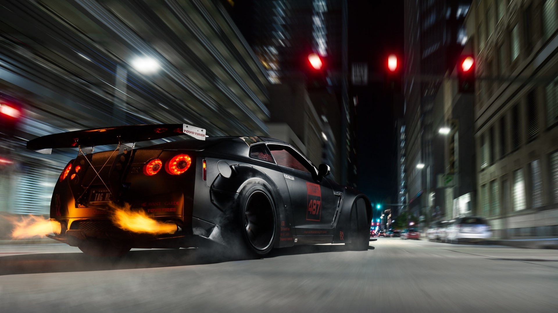 Nissan GT-R with flames on city street at night HD Wallpaper