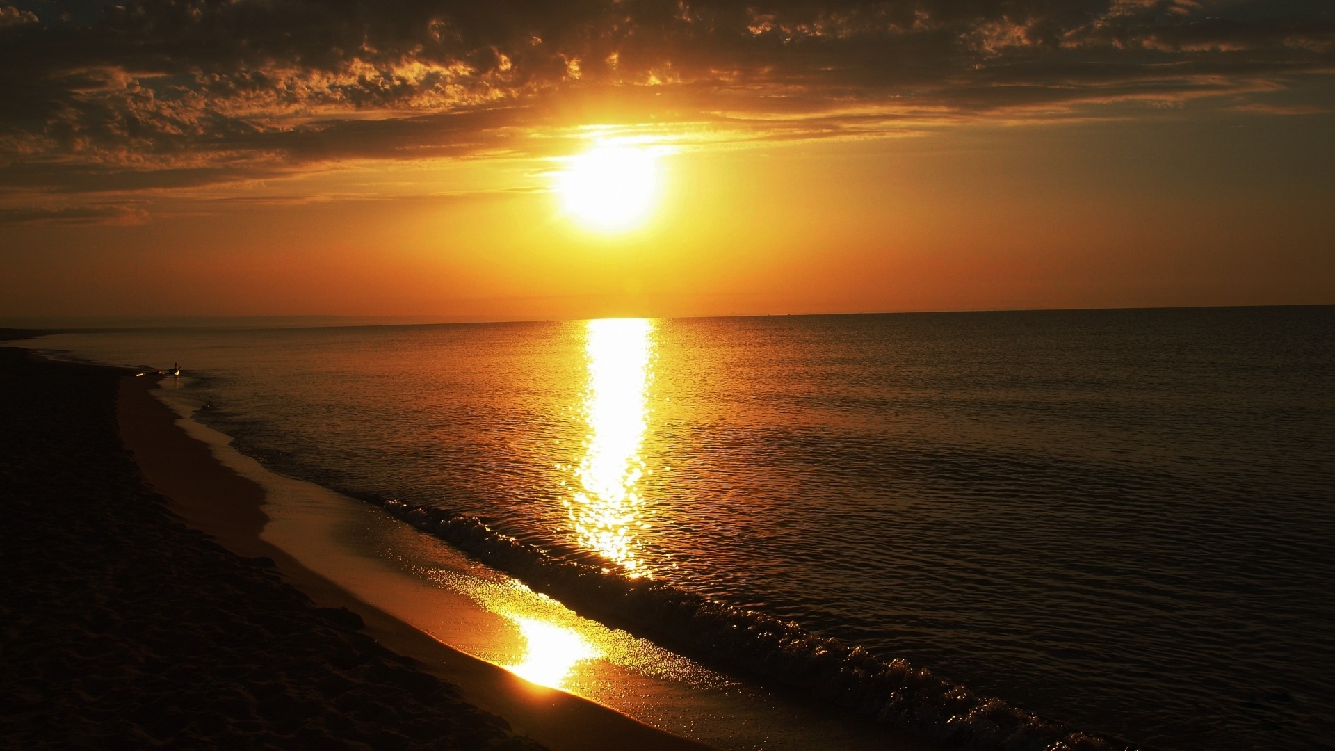 Sunset over the ocean and beach HD Wallpaper
