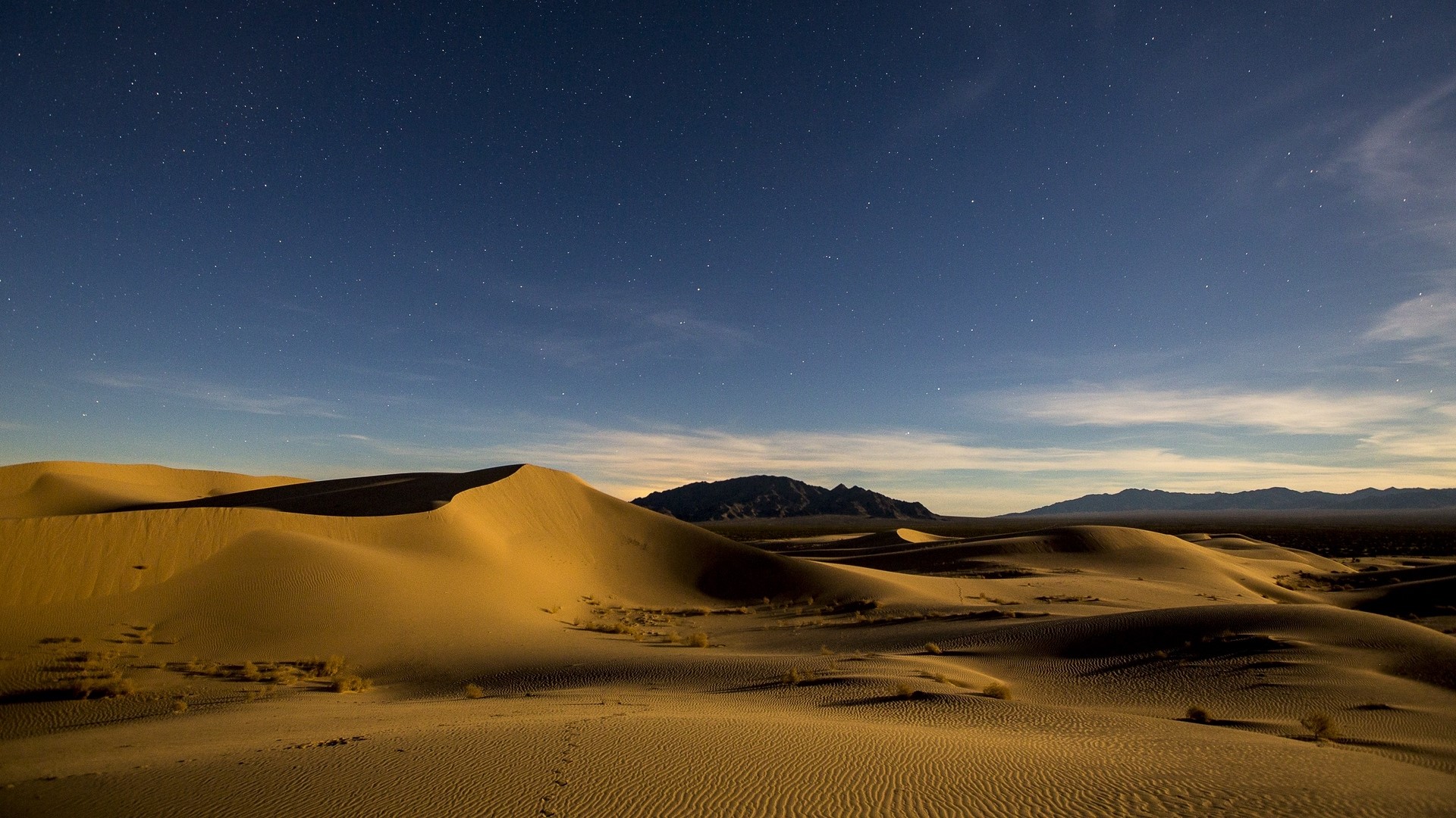 Desert dunes under a starry night sky HD Wallpaper