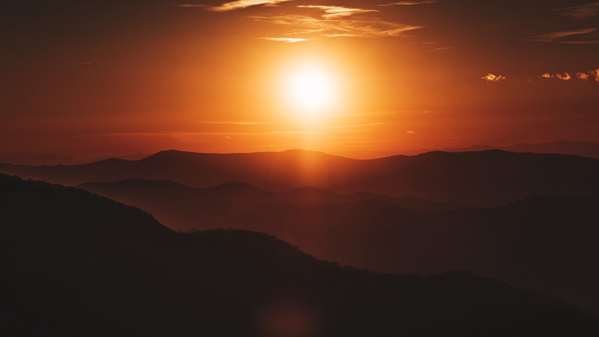 Sunset over layered mountains HD Wallpaper