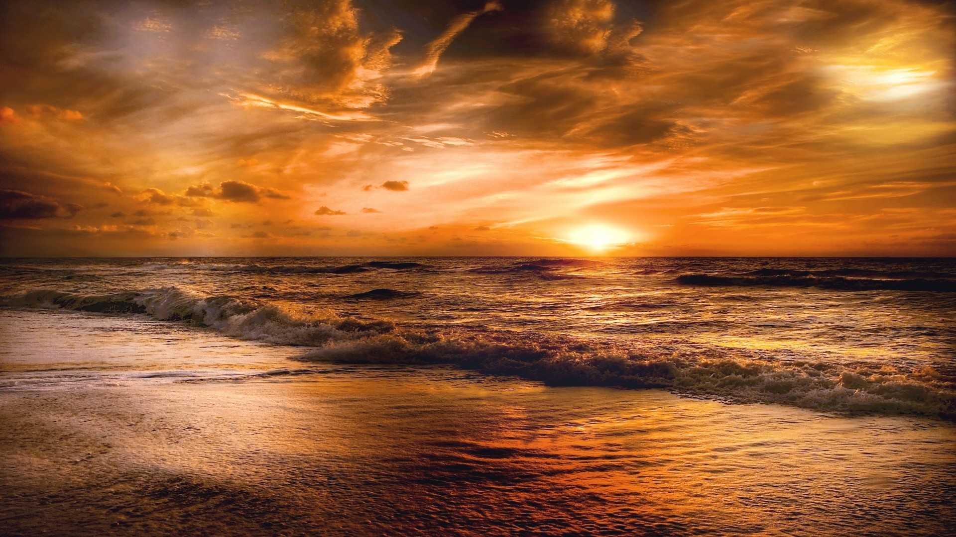 Sunset over the ocean with waves HD Wallpaper