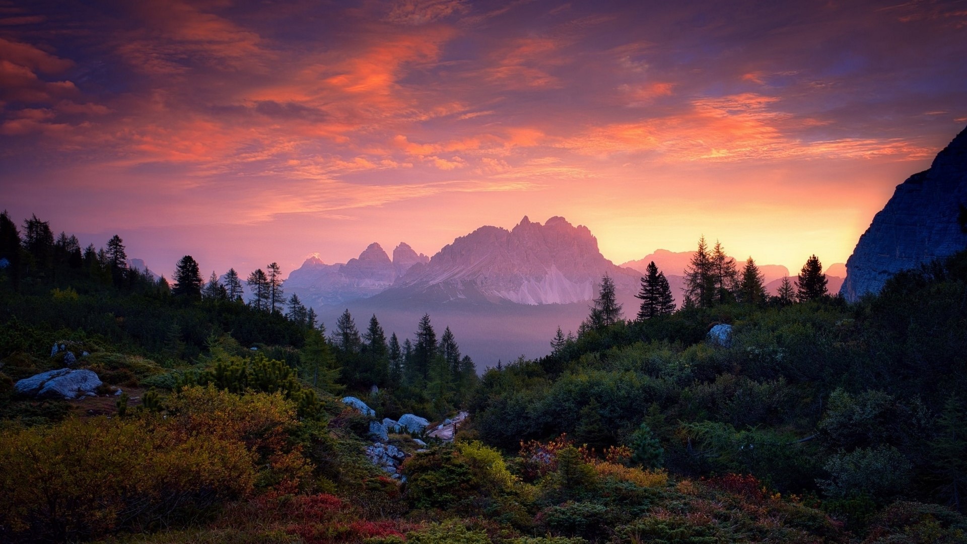 Mountain range at sunset with colorful sky HD Wallpaper