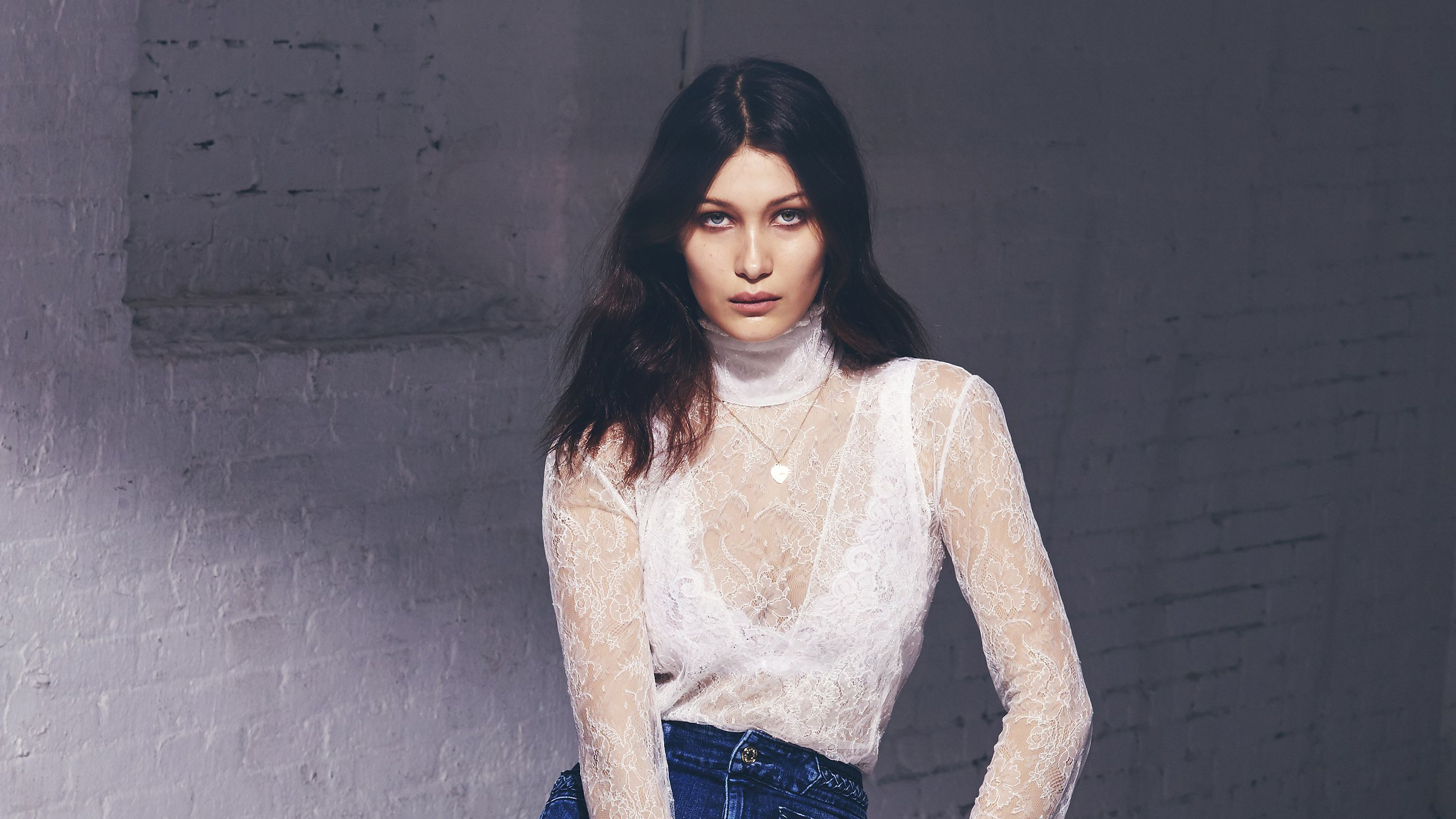 Bella Hadid in white lace top and jeans HD Wallpaper
