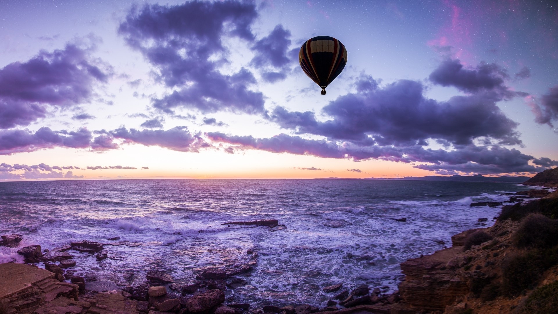 Hot air balloon over the ocean at sunset HD Wallpaper
