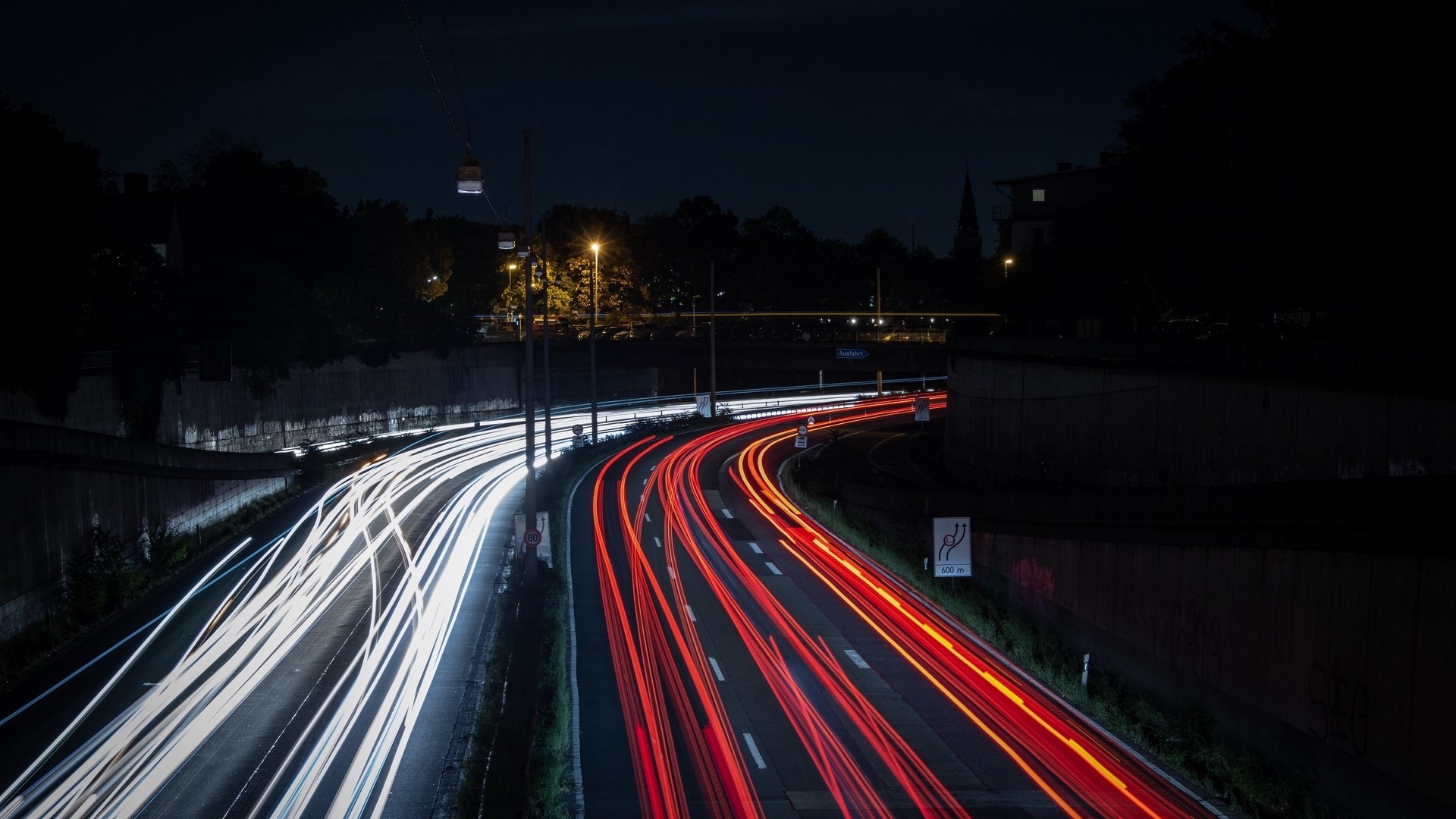 Light trails on a highway at night HD Wallpaper