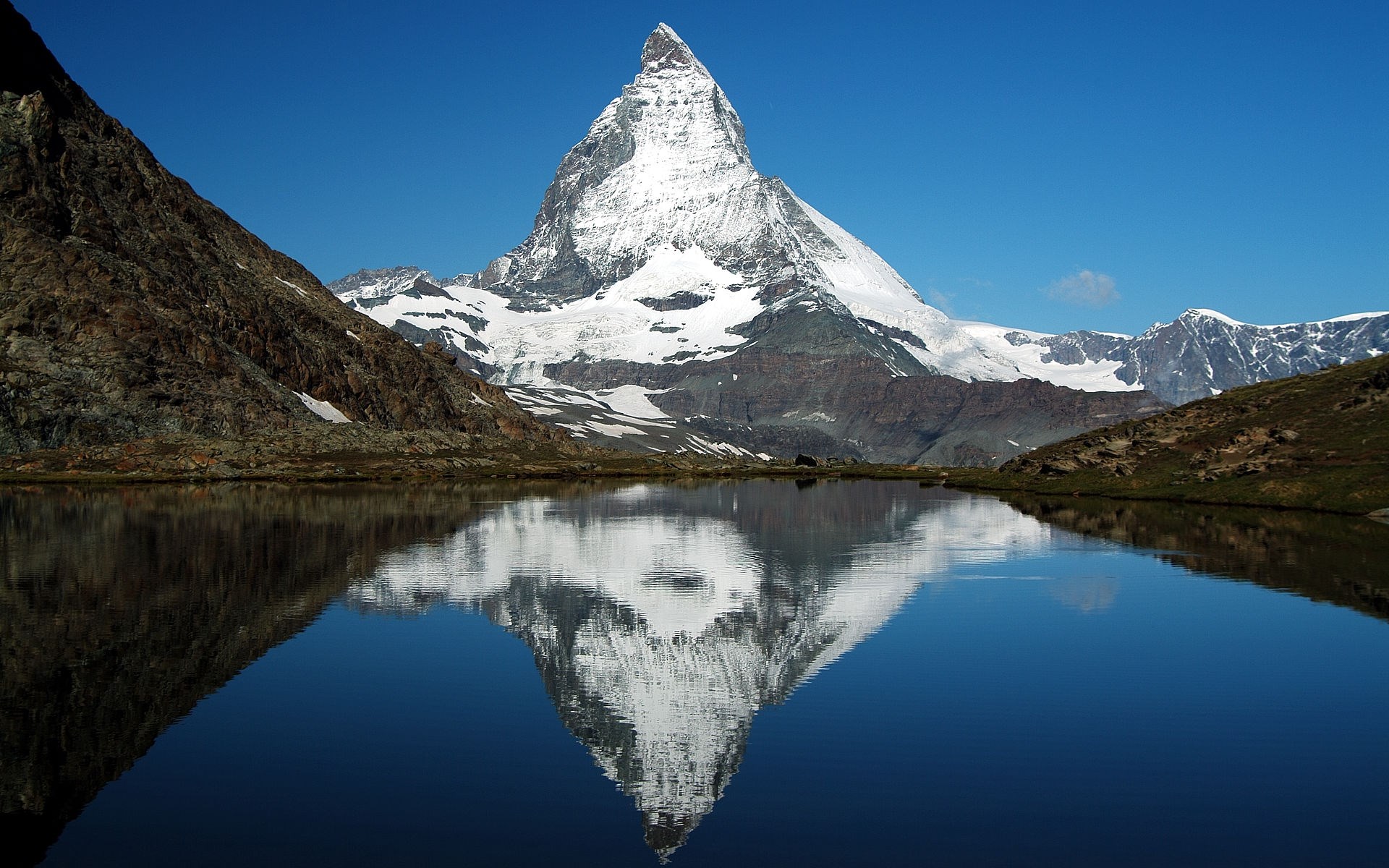 Matterhorn reflected in a mountain lake HD Wallpaper