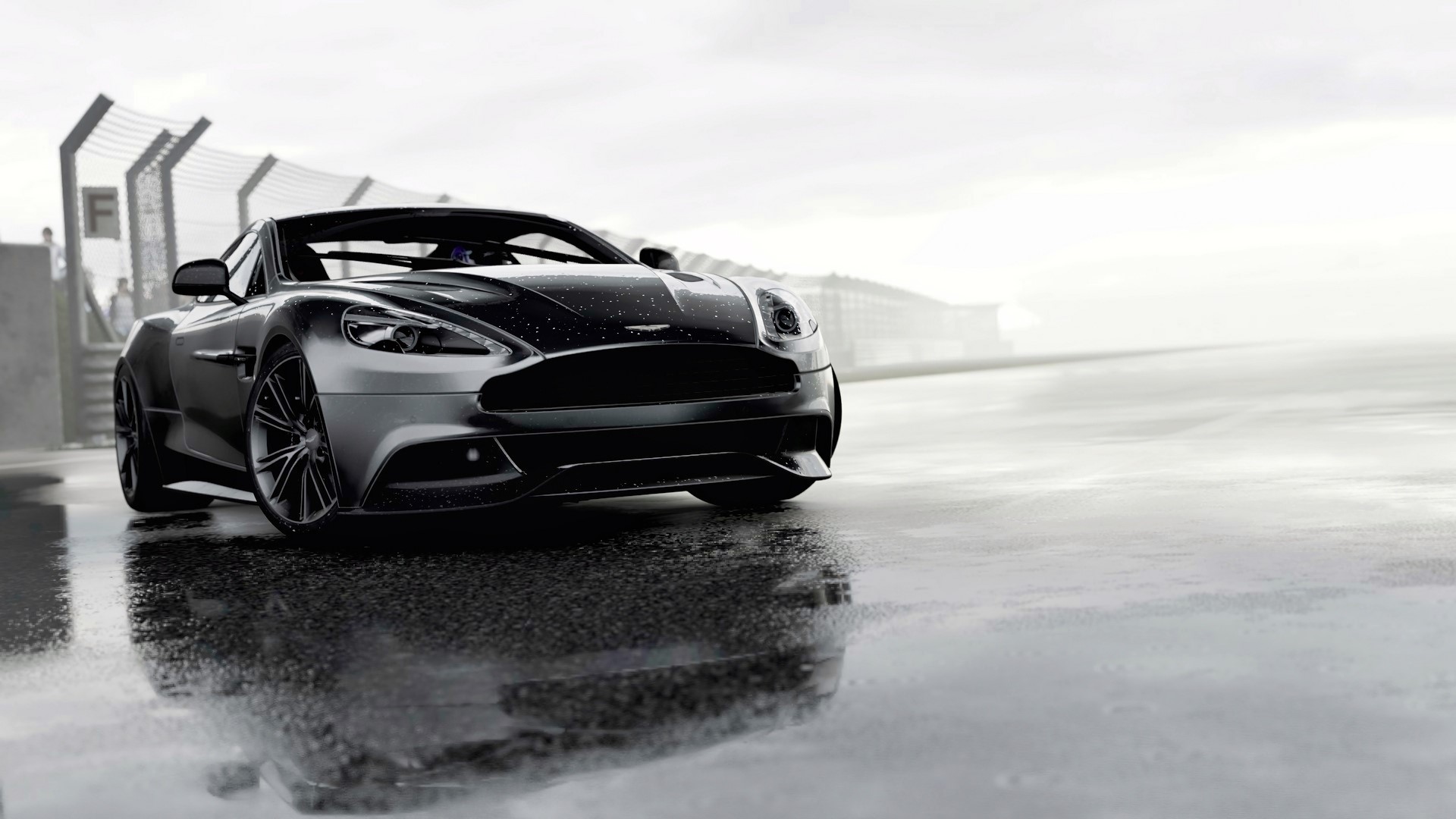 Aston Martin Vanquish on a wet racetrack HD Wallpaper