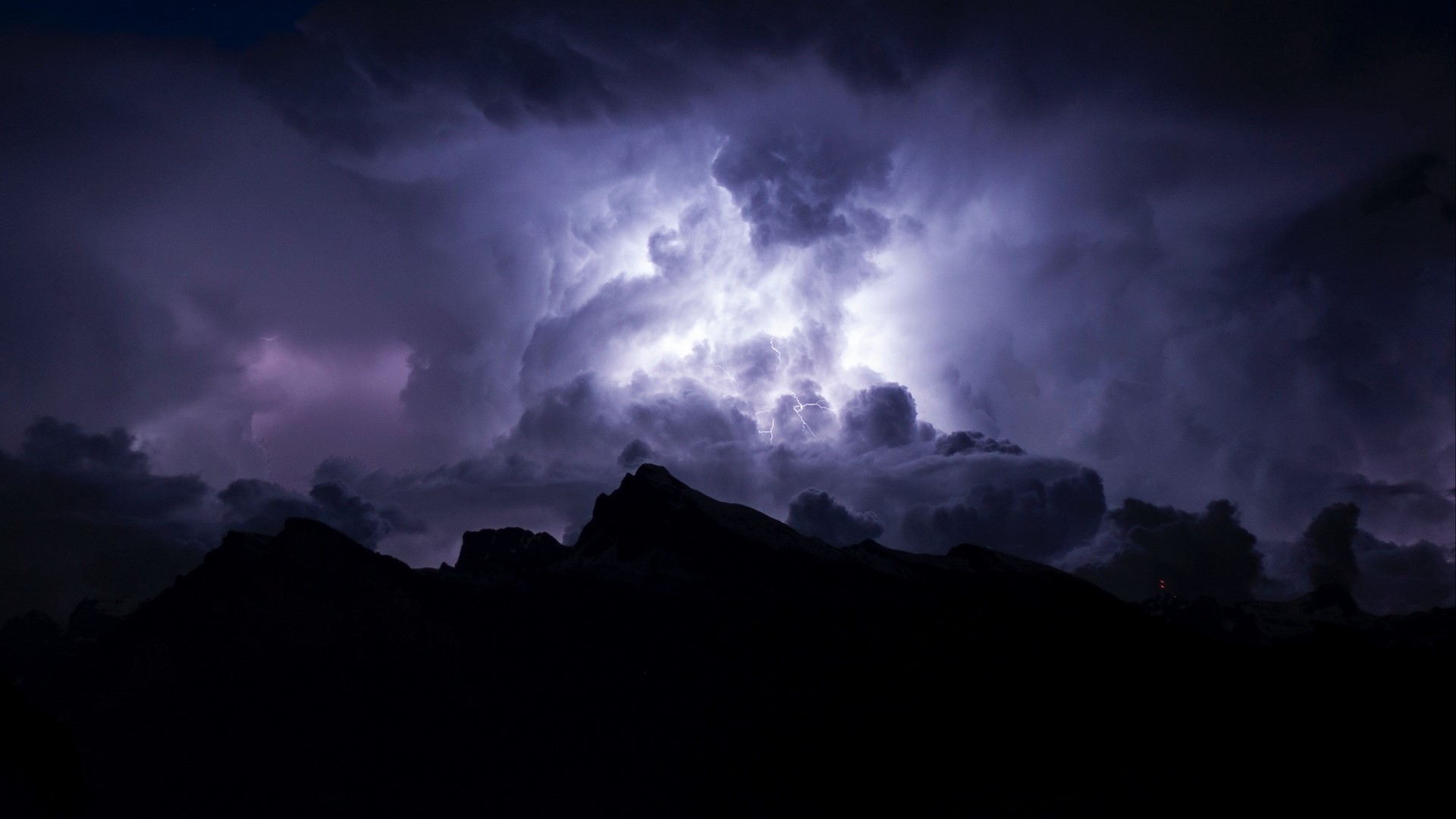 Lightning storm over dark mountains HD Wallpaper
