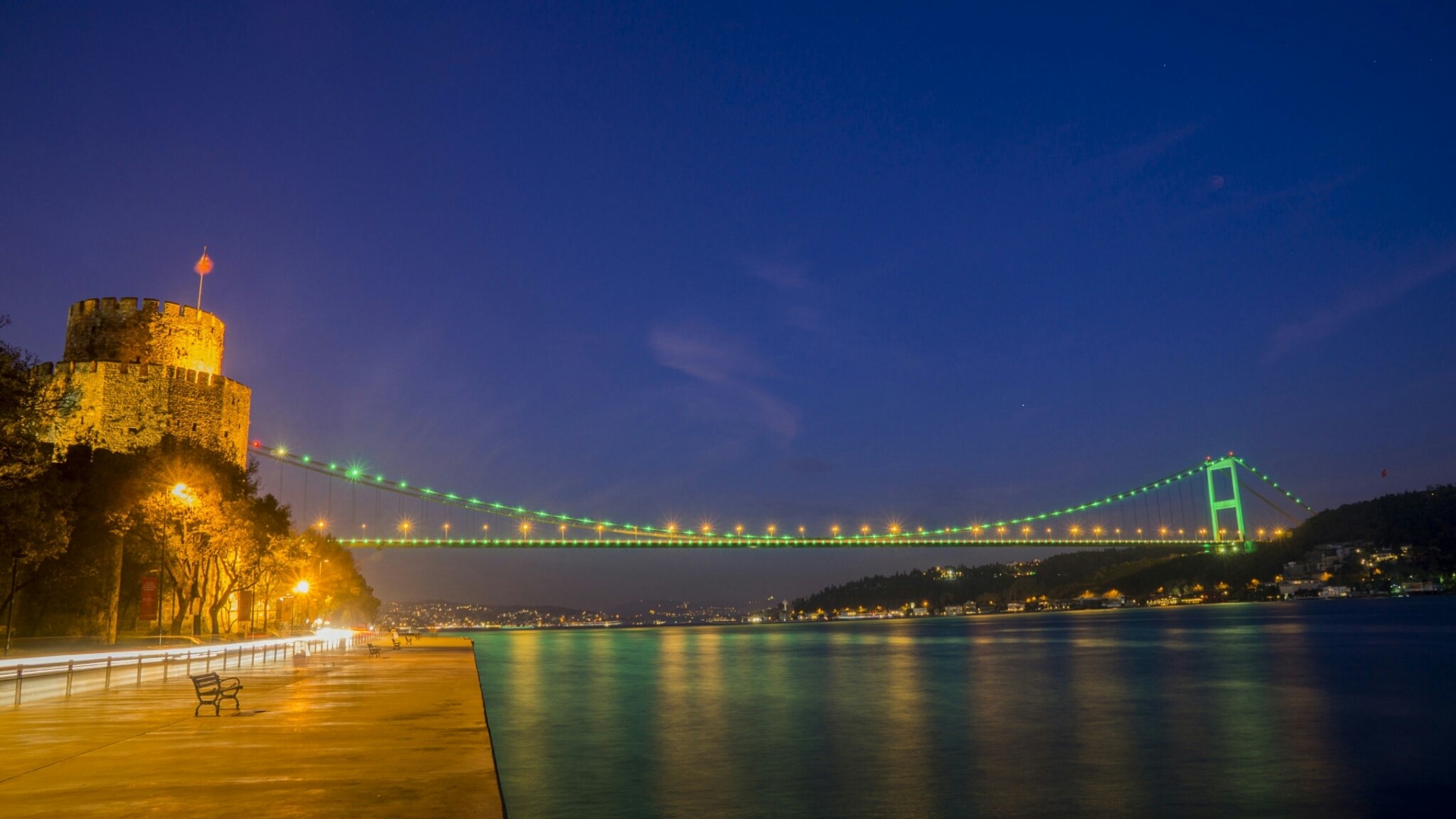 Rumeli Hisari fortress and Bosphorus Bridge at night HD Wallpaper