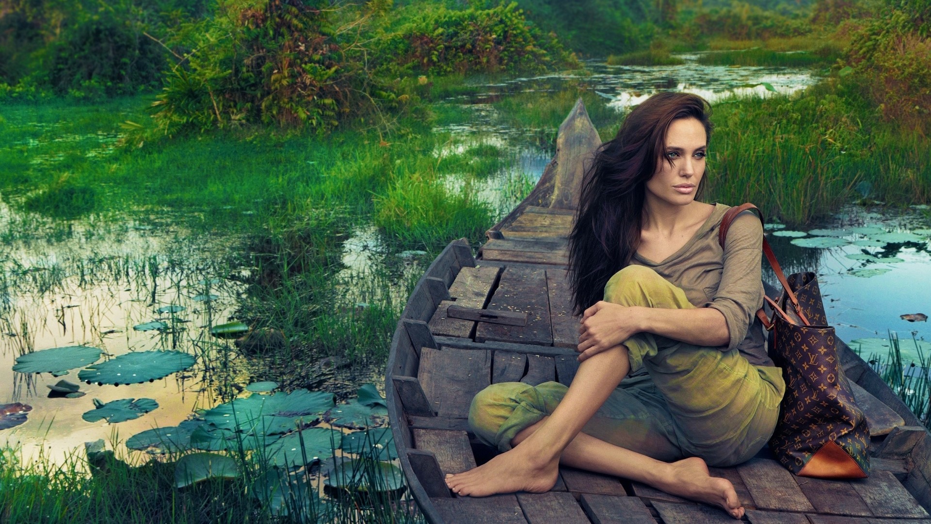 Angelina Jolie in a boat on a swamp HD Wallpaper