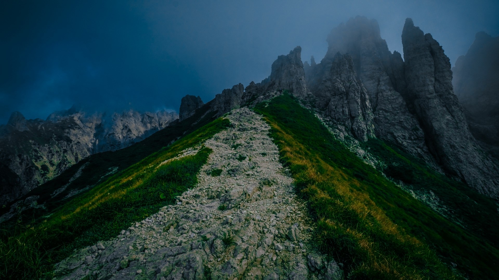 Rocky path on a foggy mountain slope HD Wallpaper