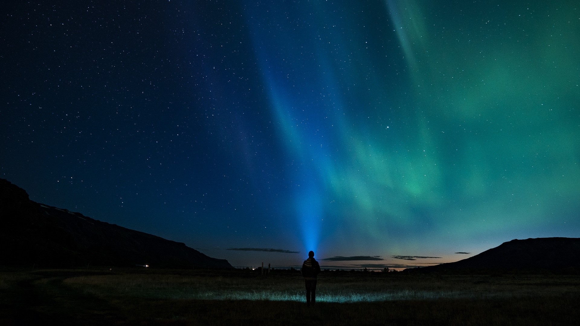 Person watching Northern Lights in Iceland HD Wallpaper
