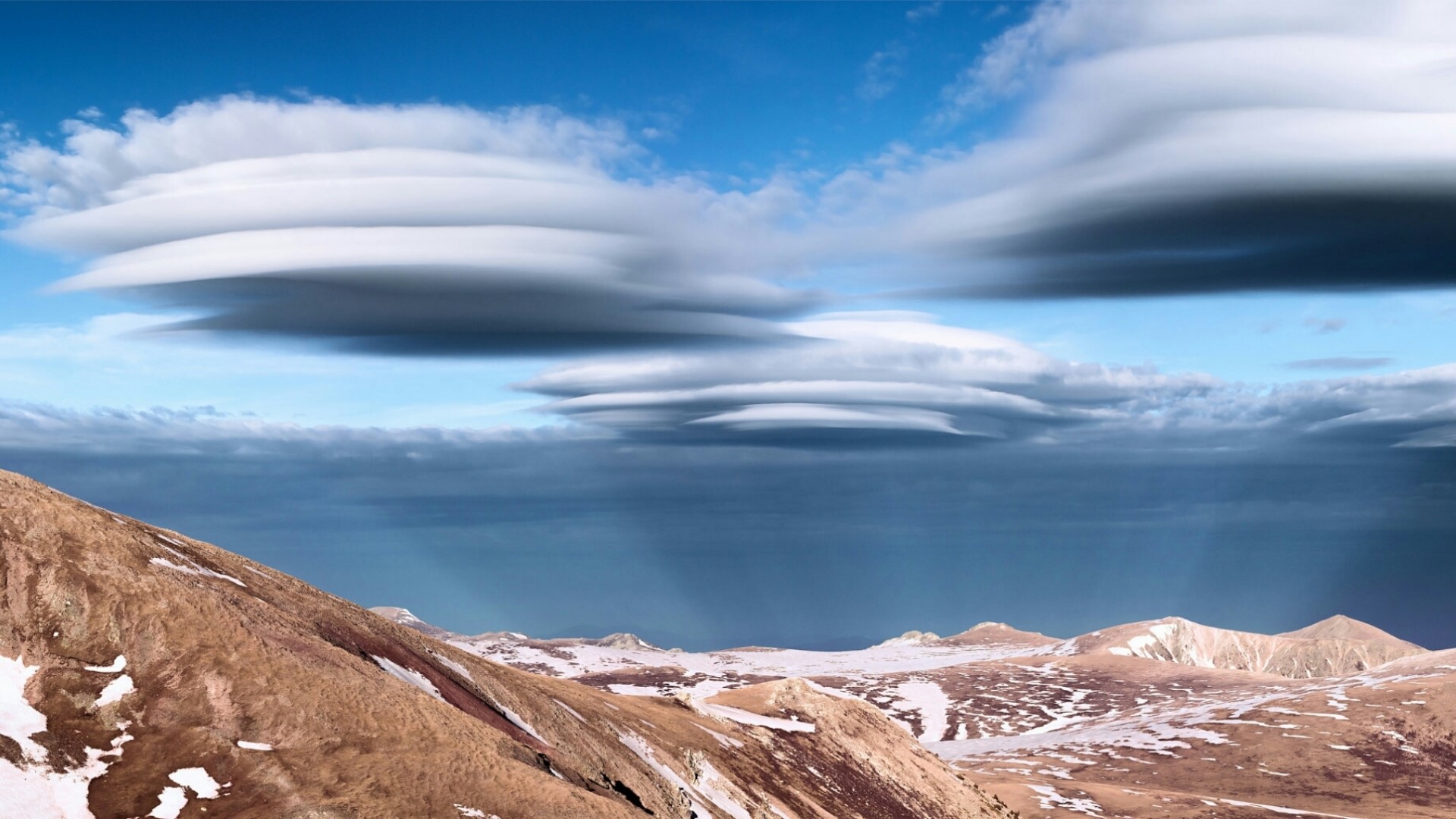 Lenticular clouds over mountains HD Wallpaper