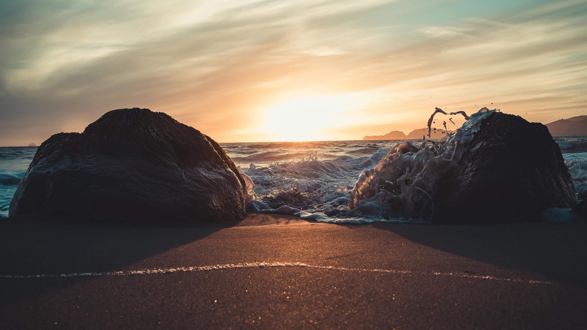 Waves crashing on rocks at sunset HD Wallpaper