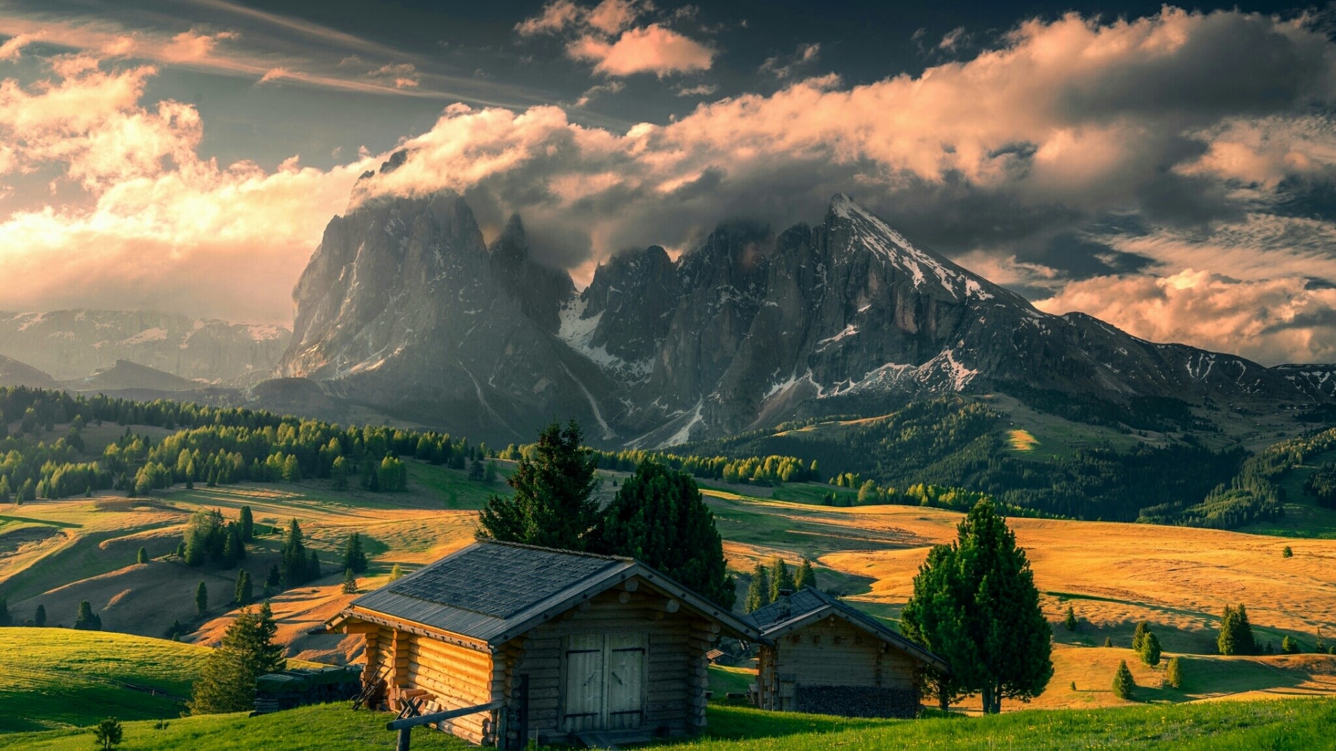 Small wooden houses in a mountain landscape HD Wallpaper