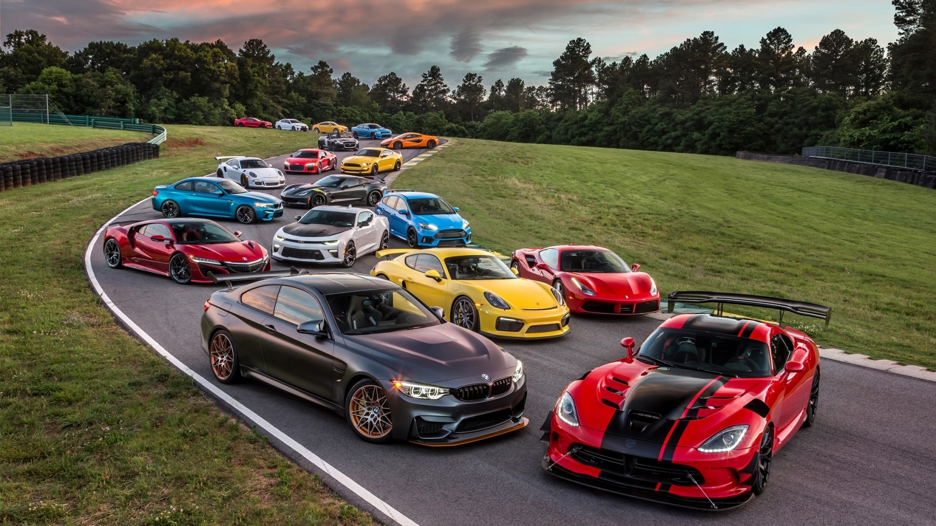 Collection of Supercars on a Racetrack HD Wallpaper