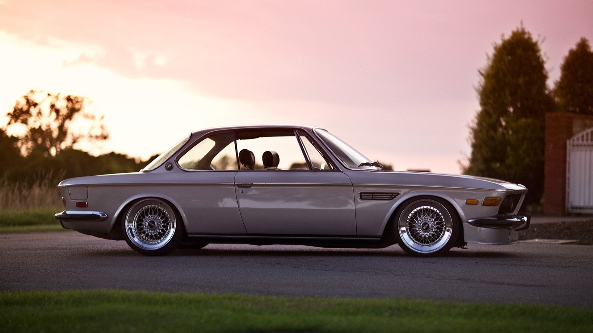 Retro BMW coupe on a road at sunset HD Wallpaper