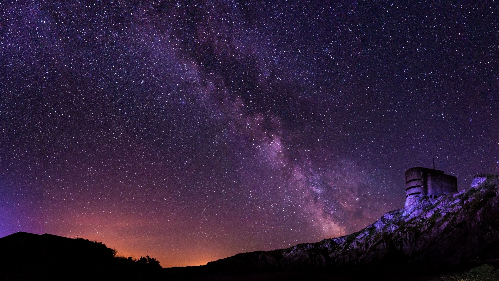 Milky Way over a bunker on a hill HD Wallpaper