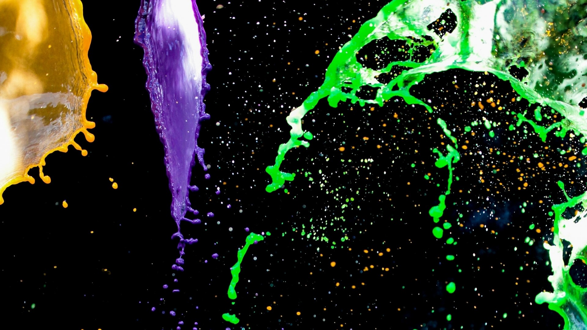 Colorful liquid splashes against a black background HD Wallpaper
