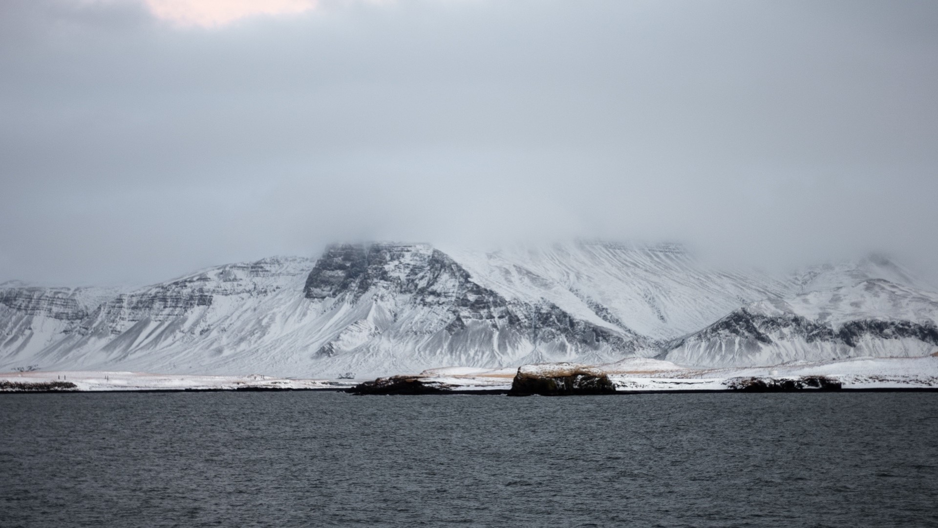 Snowy Mountains Overlooking Water in Iceland HD Wallpaper