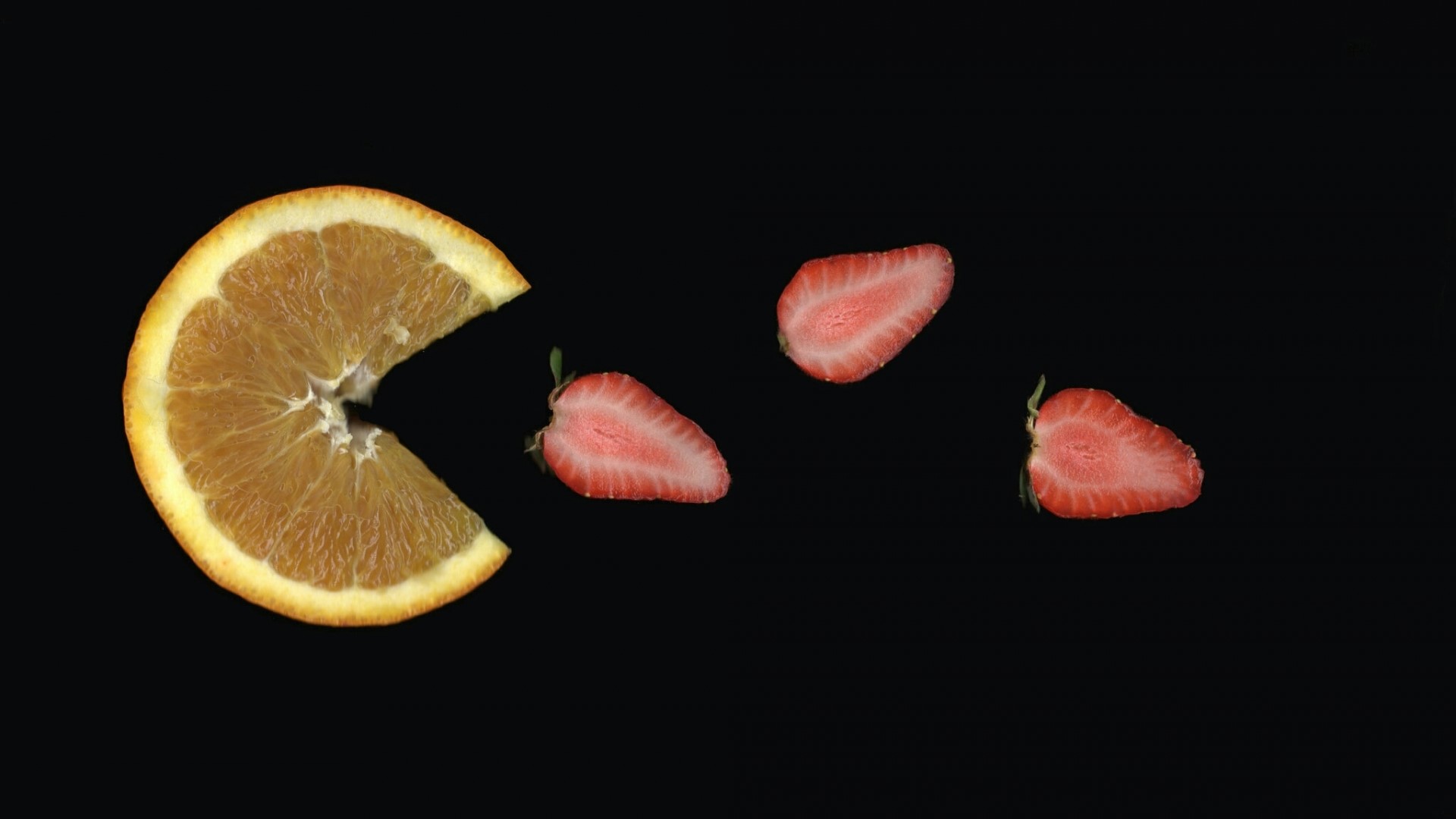 Orange slice and strawberries on black background HD Wallpaper