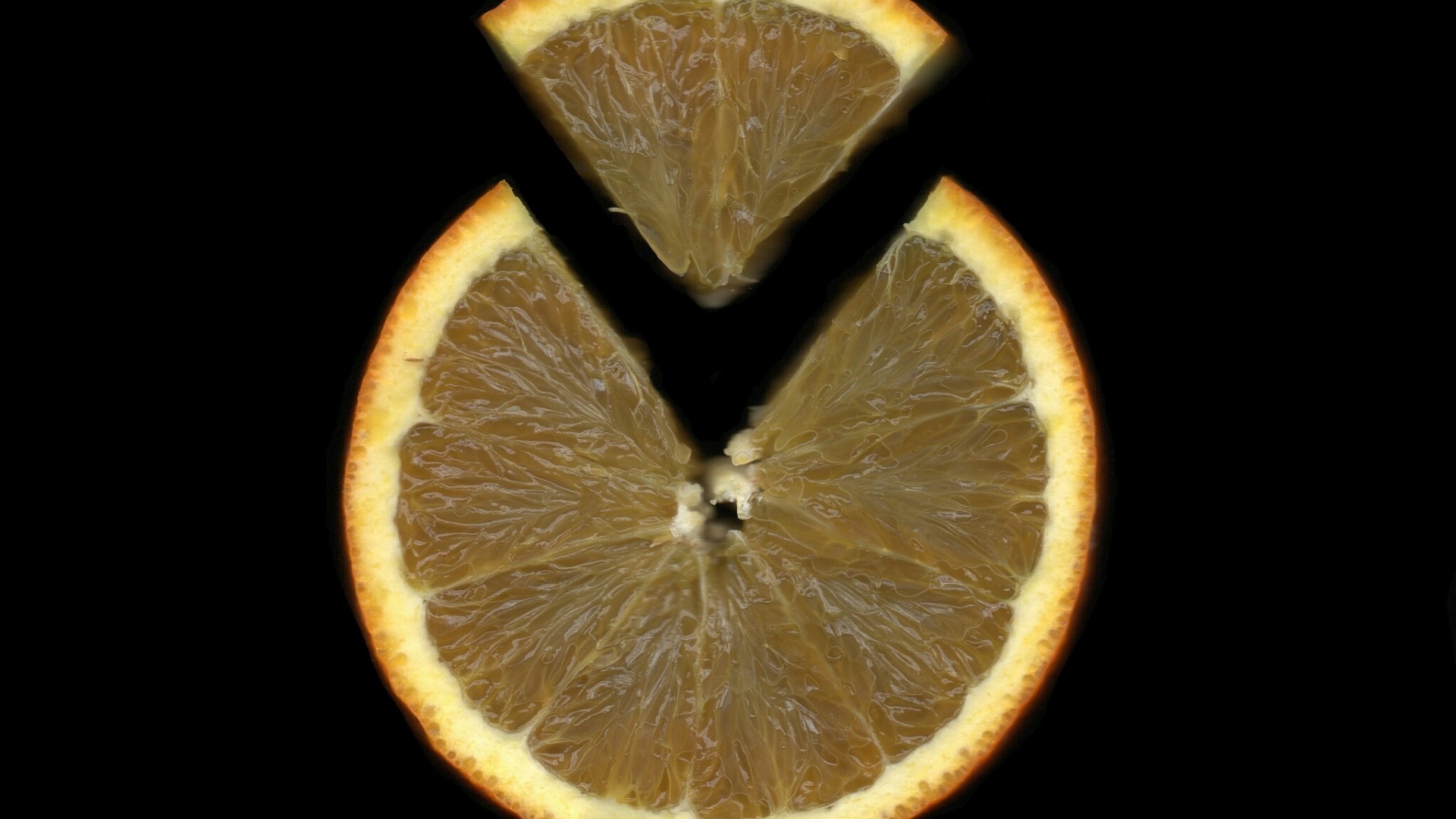 Sliced orange on a black background HD Wallpaper