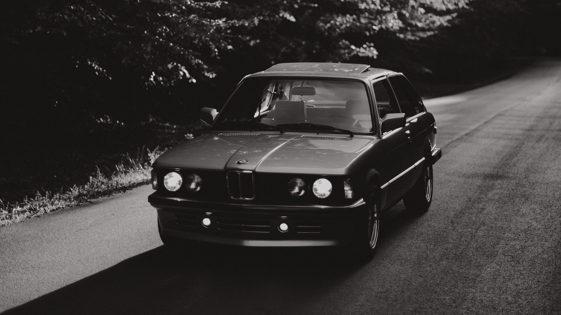 Black and white BMW car on a road HD Wallpaper