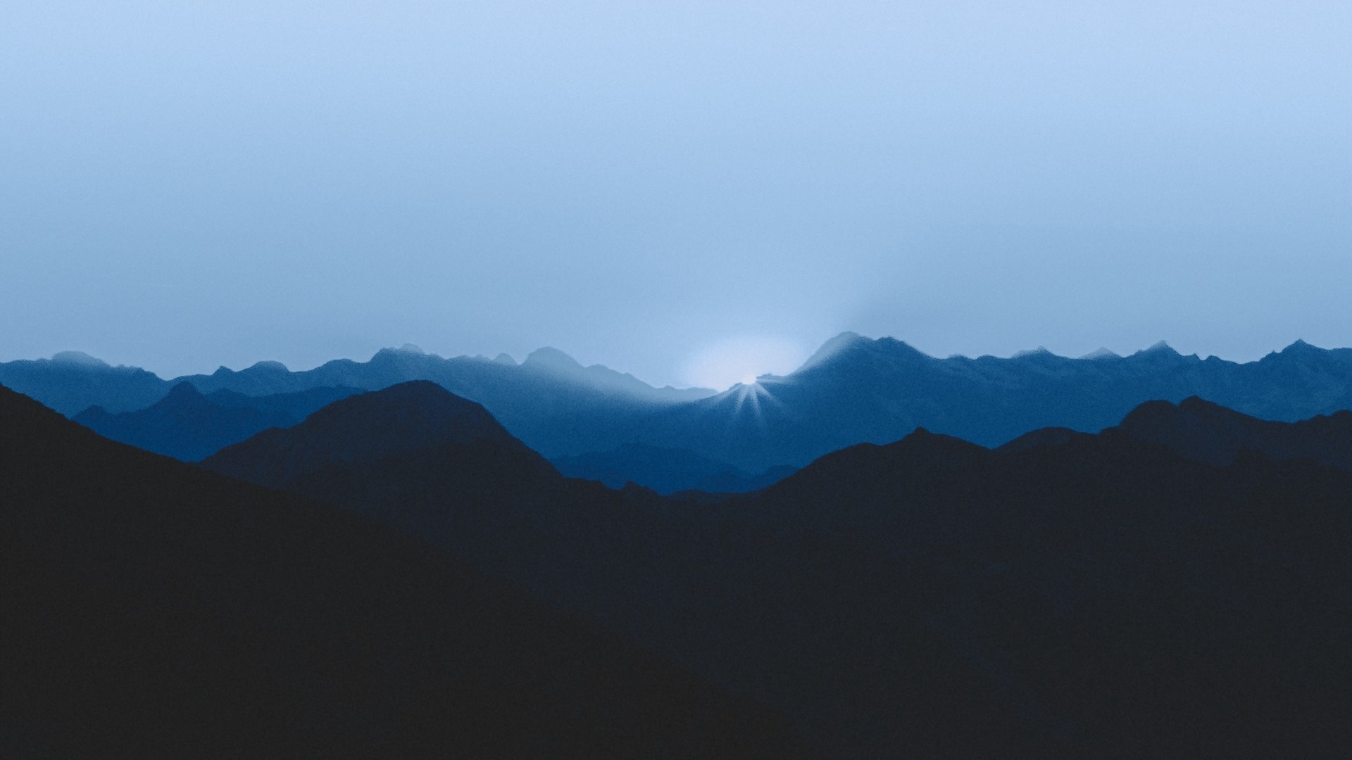 Sunrise over mountain ranges HD Wallpaper