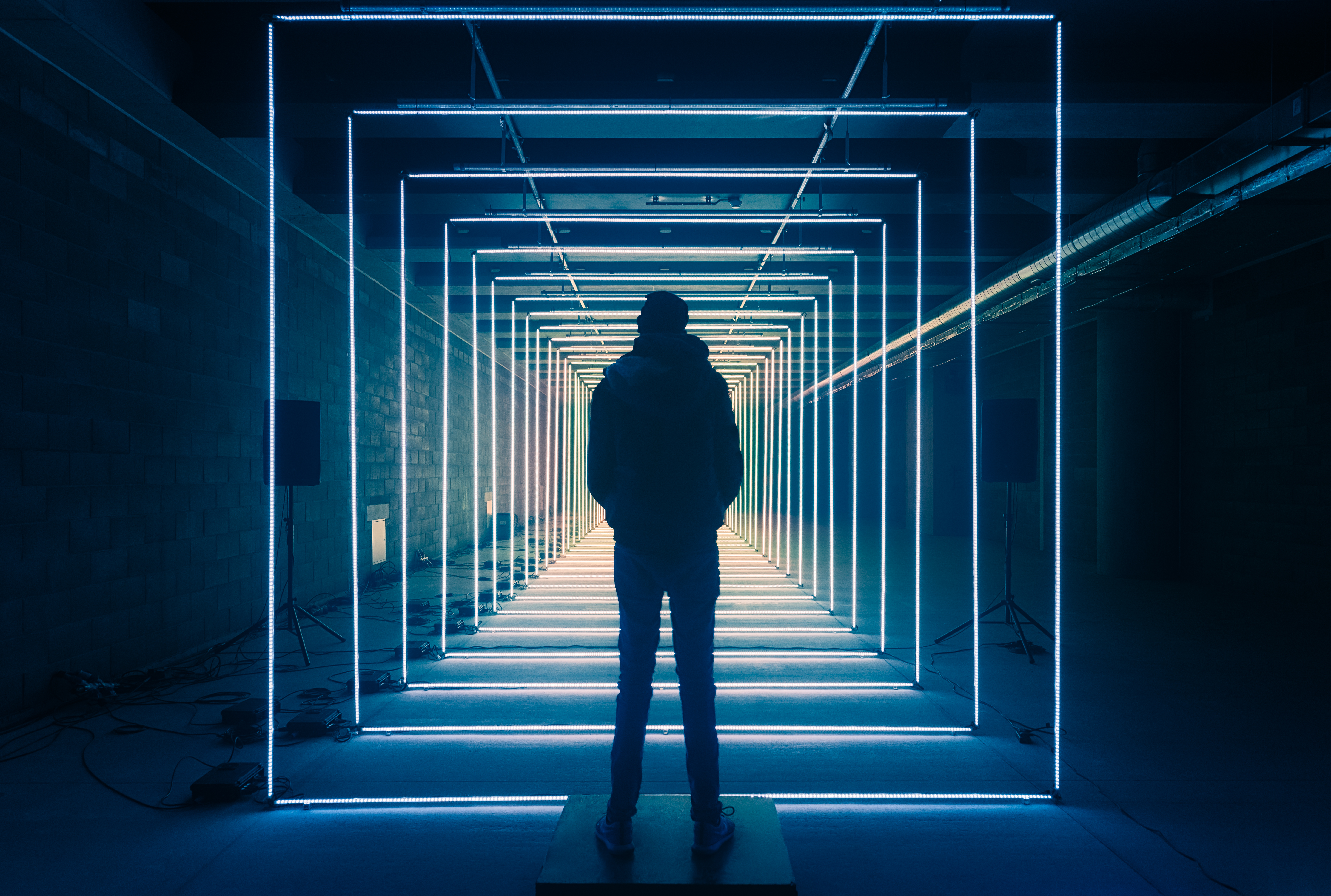 Person in LED light tunnel HD Wallpaper