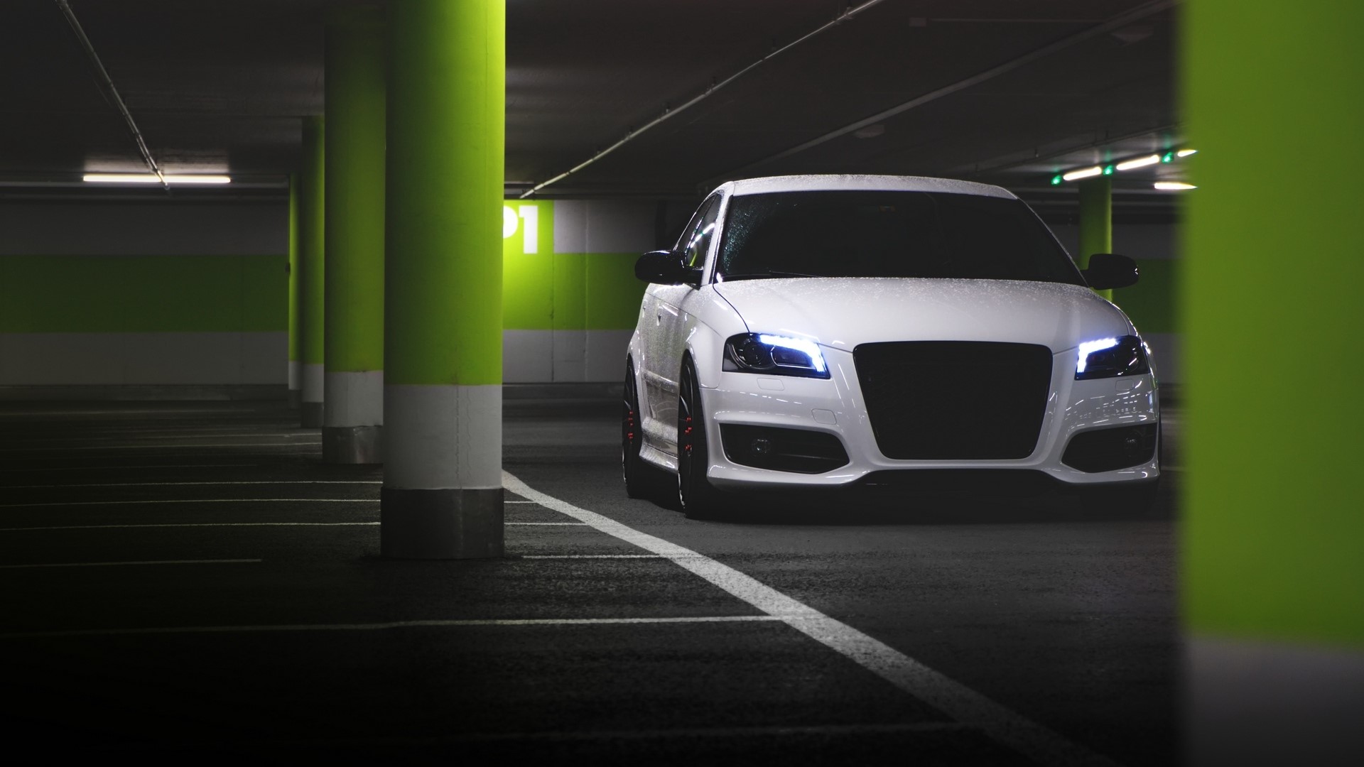 White Audi in a parking garage HD Wallpaper