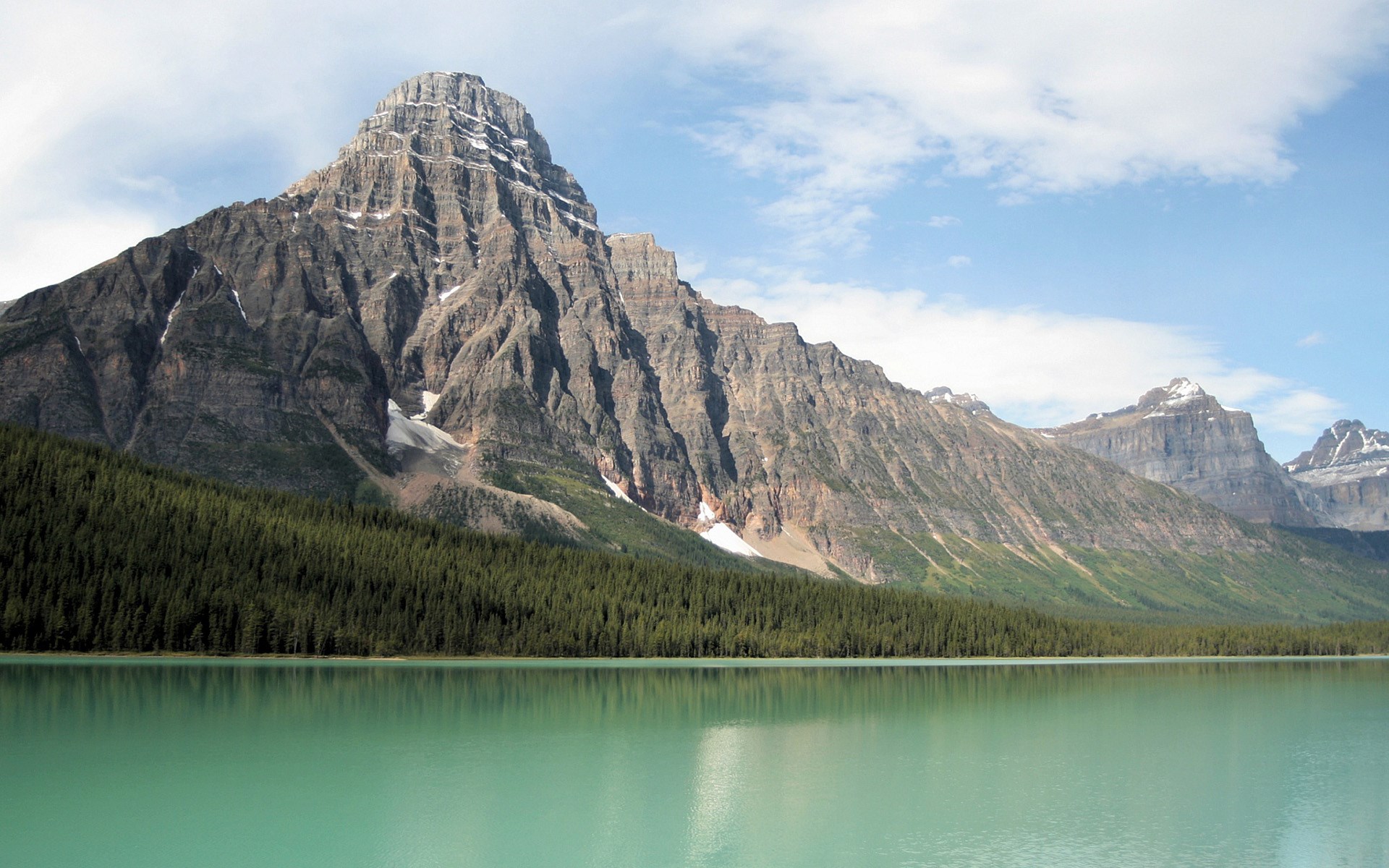 Turquoise lake and mountains with pine forest HD Wallpaper